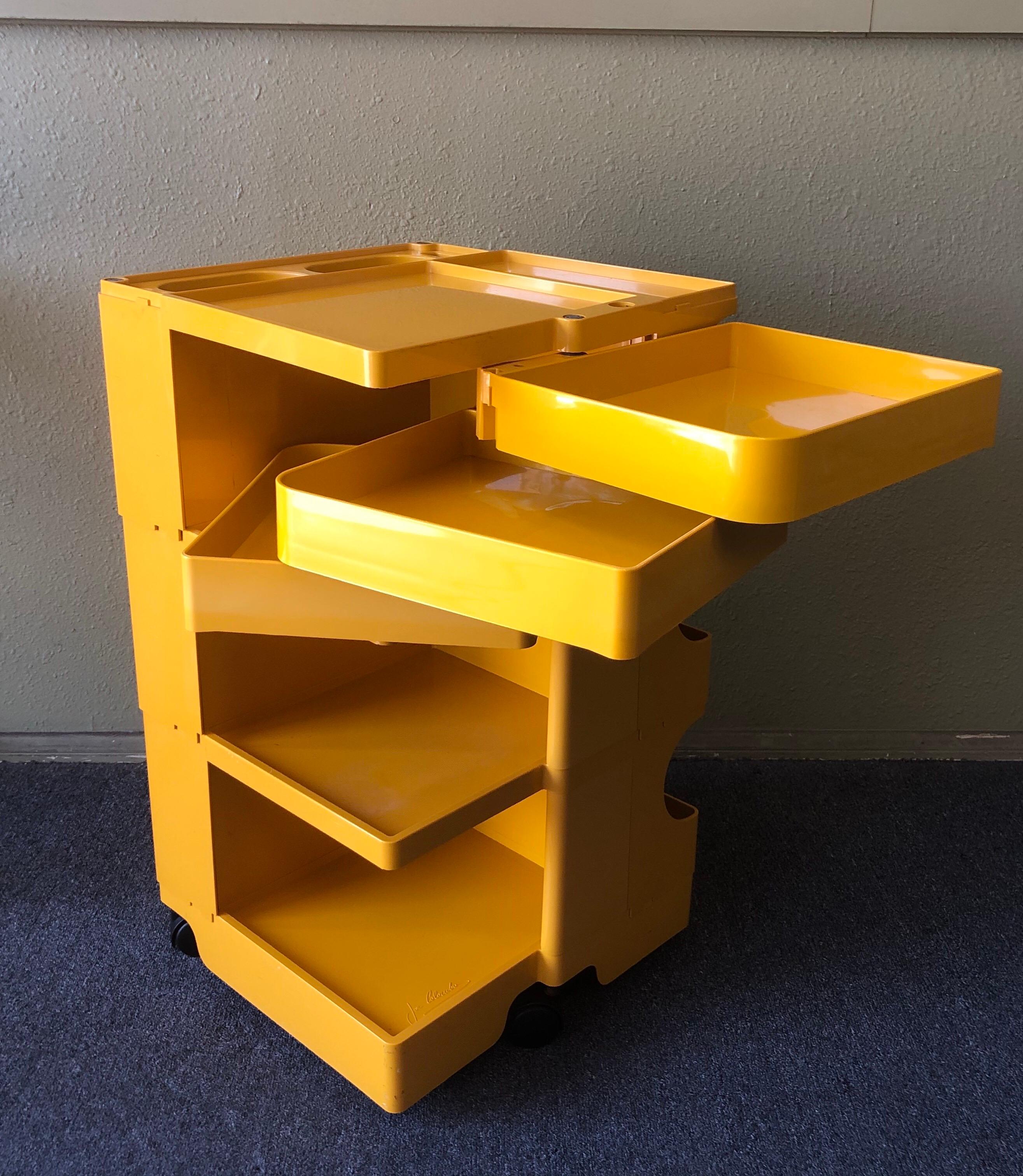 Vintage Boby 3 trolley in honey yellow by Joe Colombo for Bieffeplast, circa 1969. The iconic Boby 3 portable torage system by Italian manufacturer Bieffeplast makes savvy use of space with its swivel design. This compact caddy is featured in the