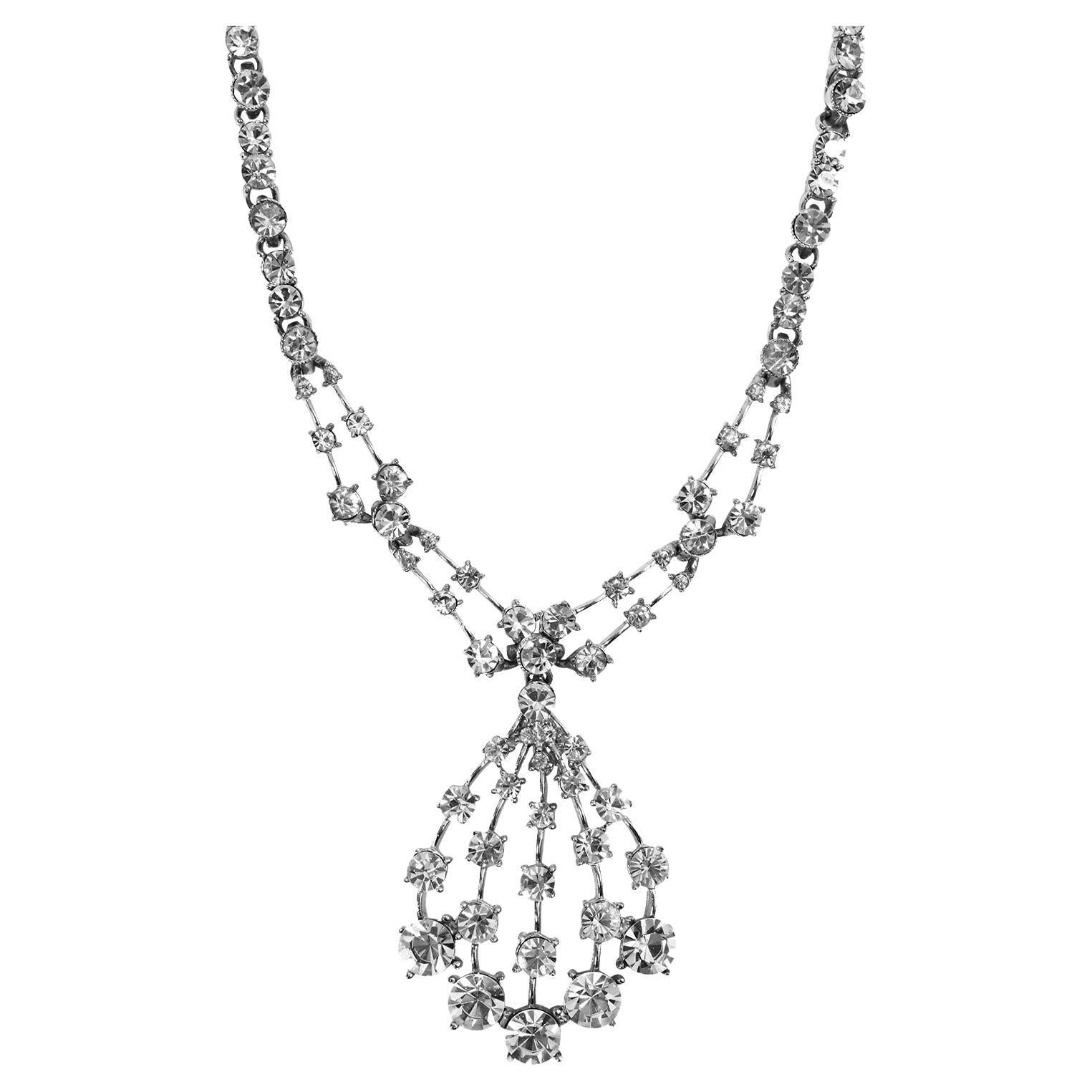 Vintage Bogoff Diamante Drop Necklace Circa 1960s. Has drop necklace and is on links of stones with designs.  There are two 6 stone designs with a stone separating them and that leads to a higher stone and then two lower stones and then the pattern