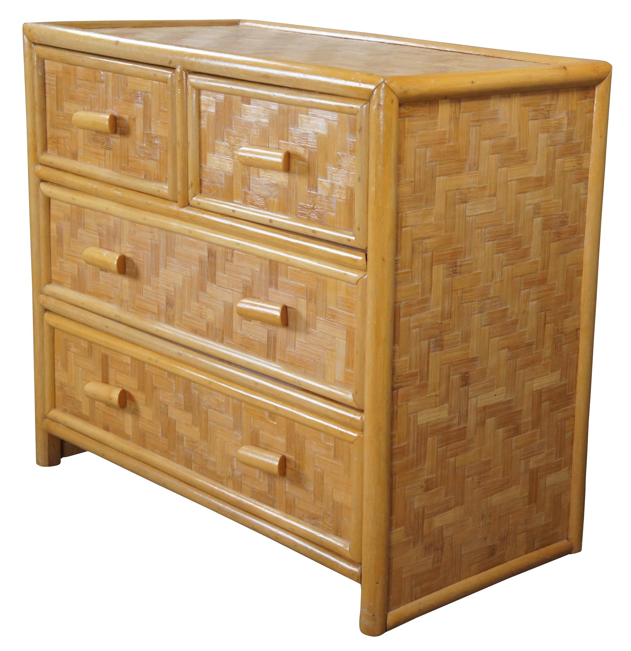 Vintage Hollywood Regency / Bohemian dresser, circa last quarter 20th century. Features a bamboo frame with geometric rattan panels. Includes 4 drawers.