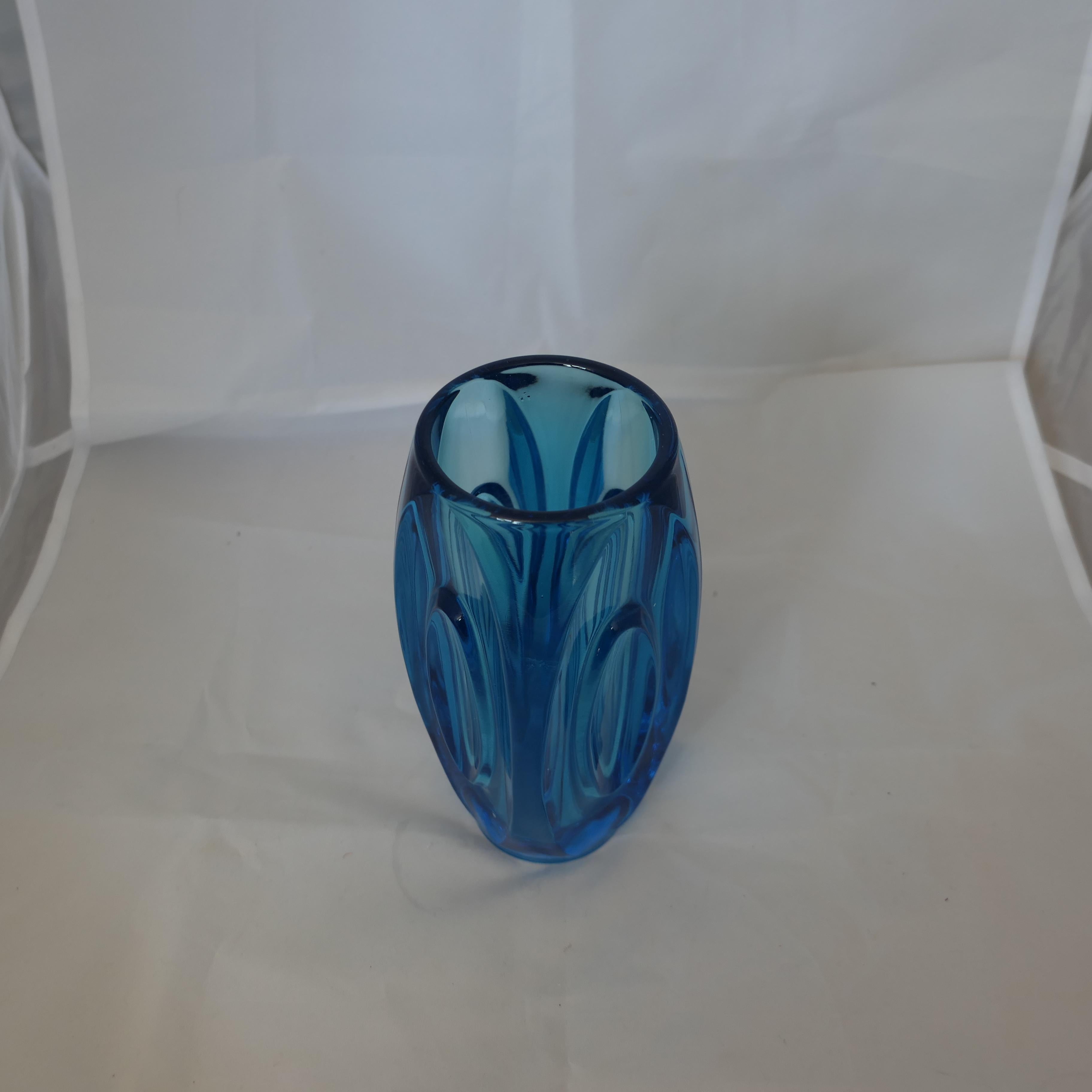 Vintage Bohemian Blue Glass Lens Bullet Vase by Rudolph Schrotter

A very stylish retro art glass blue vase by Sklo Union Rudolfova  no  chips or cracks, a lovely colour
The vase is 8” tall and 3” in diameter 
FB210
