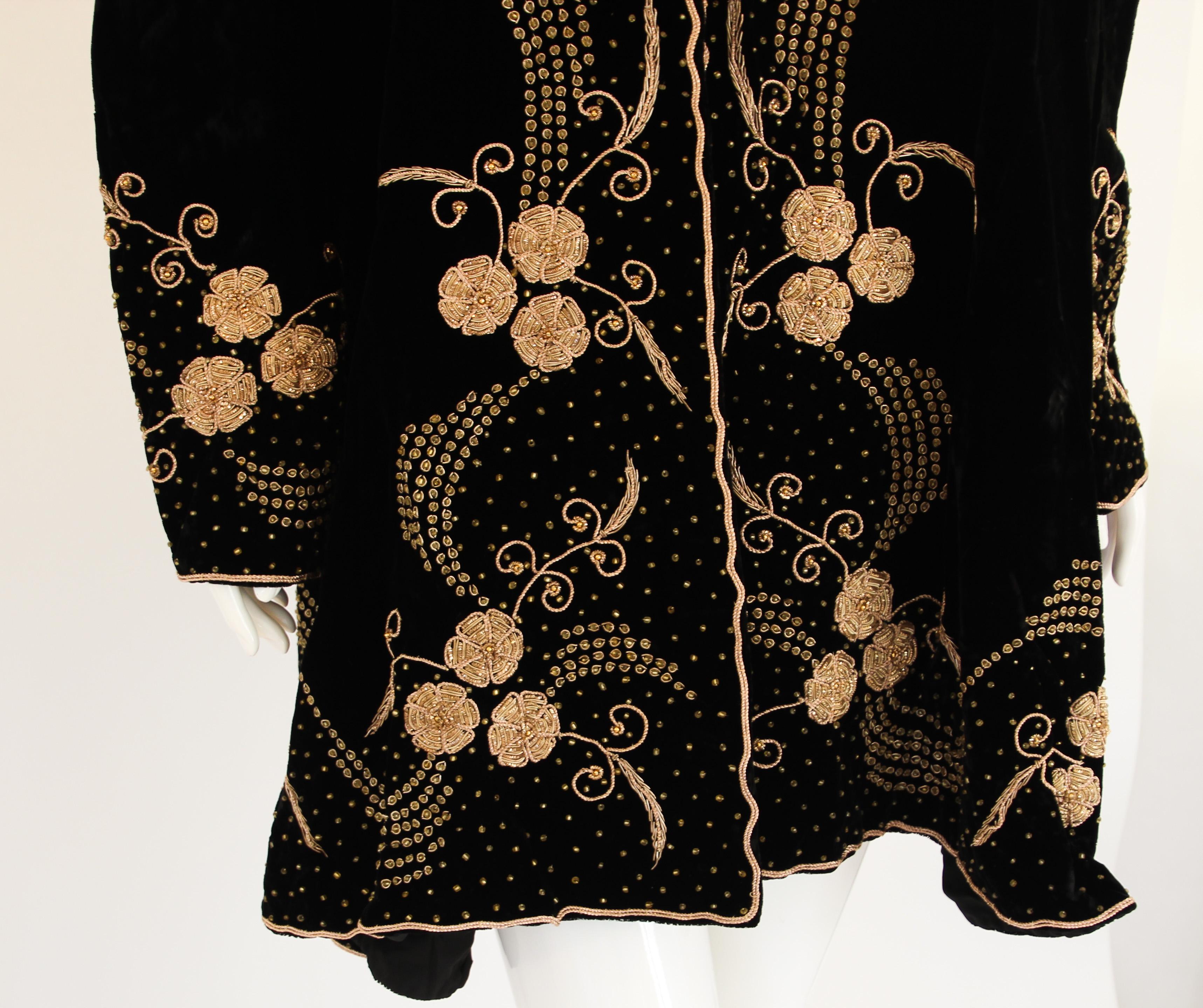 Bohemian Chic Beaded Black Velvet Jacket.
Swing coat with gold sequin and Intricate beading adds a little sparkle and shine to this velvety bohemian jacket.
Heavy beading around the collar, down the lapels, and at the bottom of the jacket and