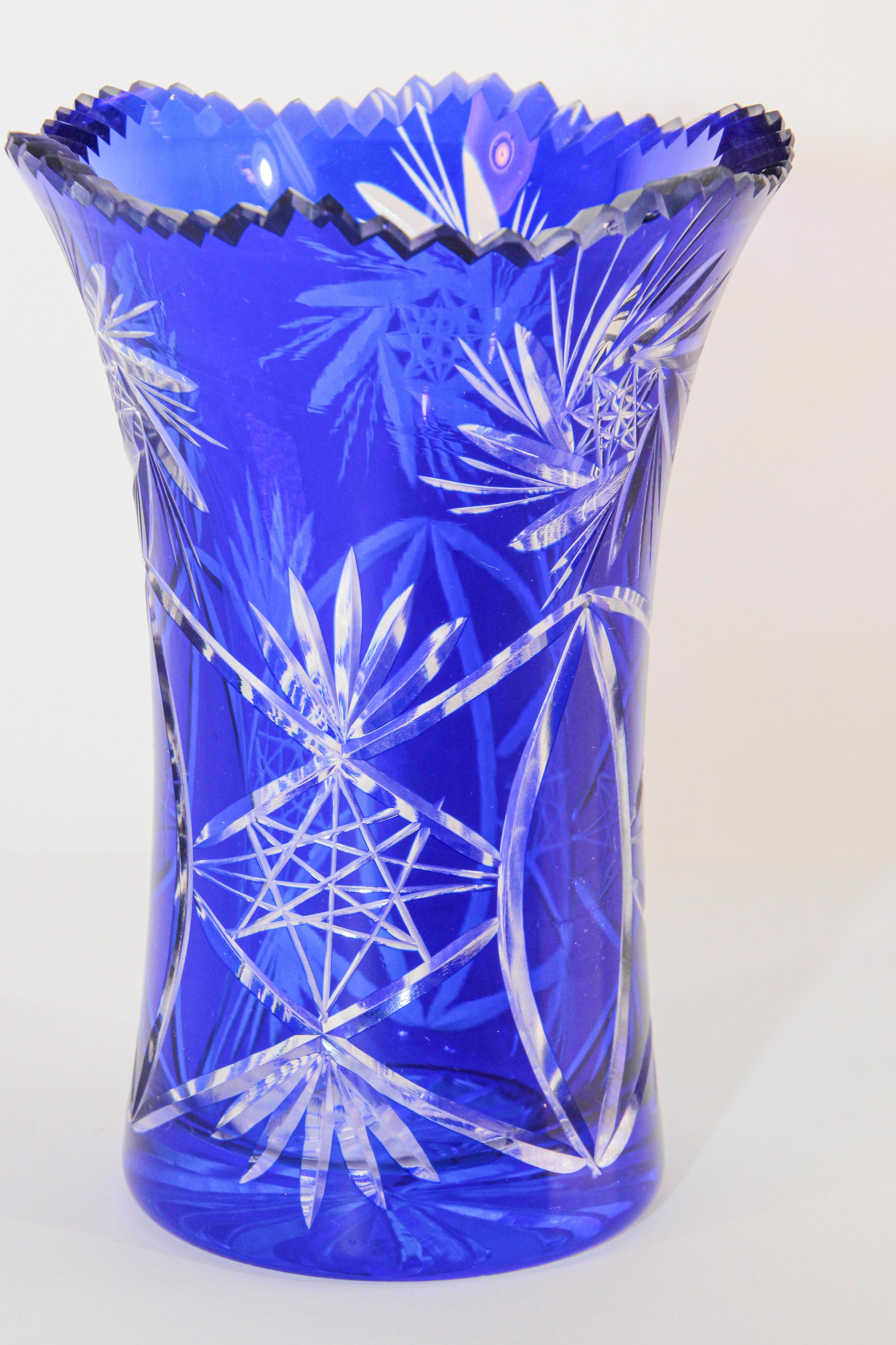 Cobalt blue cut to clear Bohemia art glass crystal vase.
A beautiful piece with cut details from top to bottom, cut to clear, cobalt blue Bohemian glass vase from Czechoslovakia. 
Vintage cobalt blue Bohemian art glass with diamond pattern with a