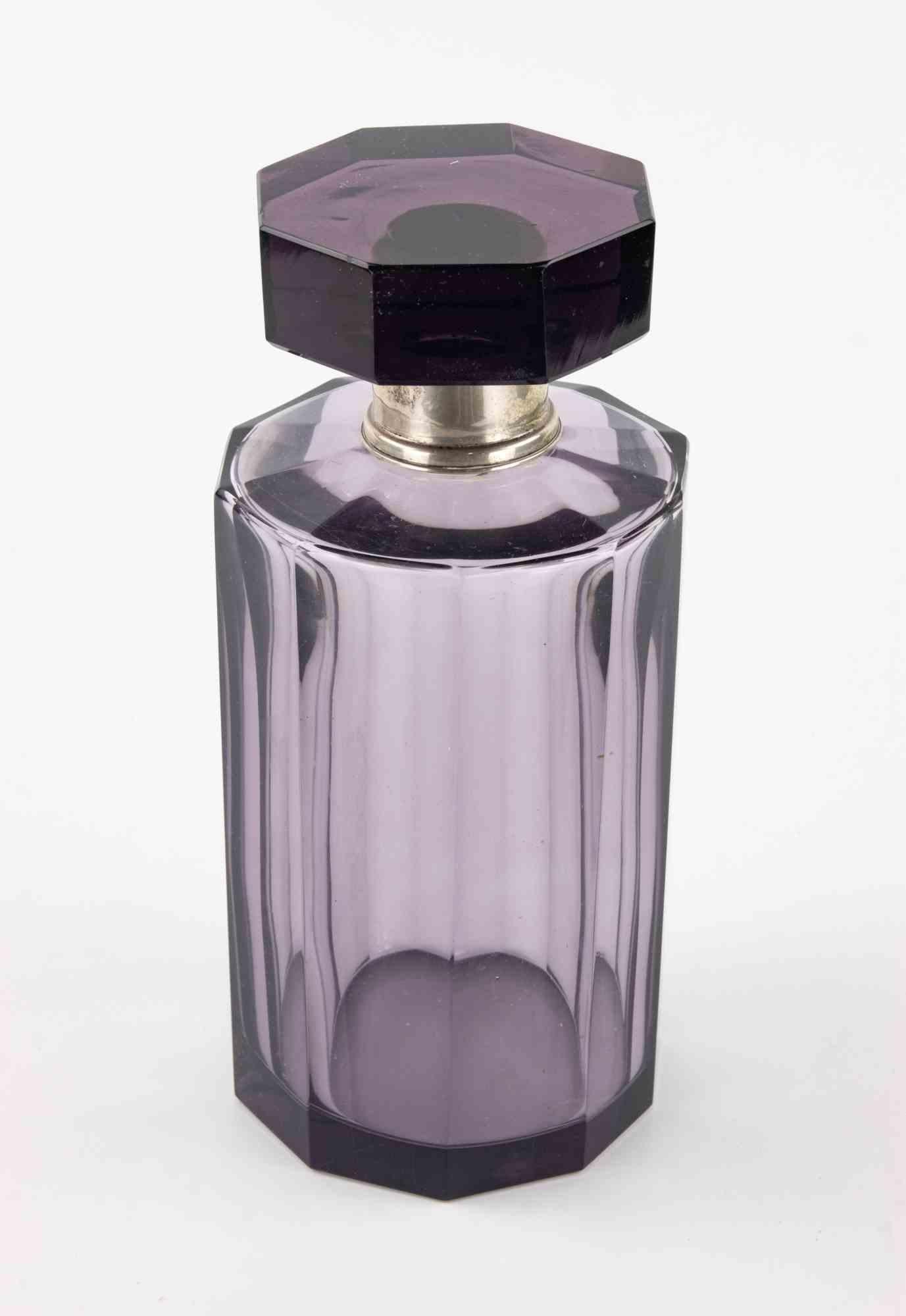 Bottiglia di vetro vintage di Boemia.

Include il suo CAP originale.

Ottime condizioni.
