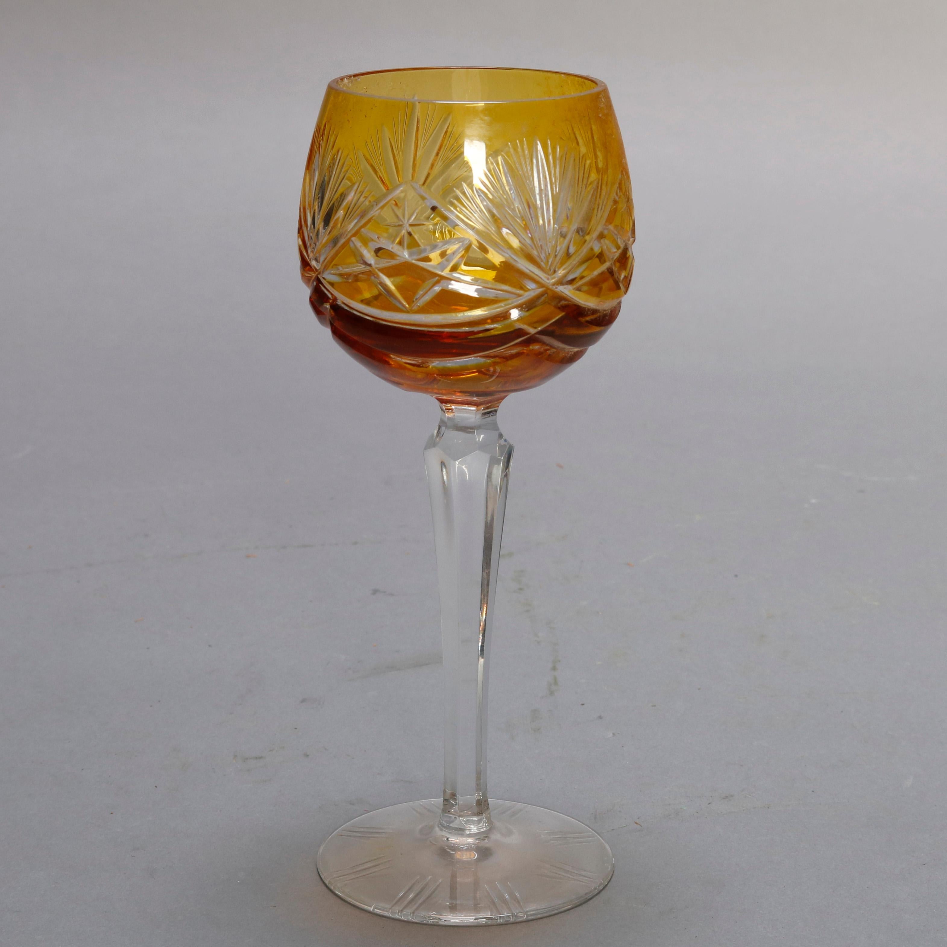 A vintage set of Bohemian Neubert-Echt Bleikristall crystal 24% stemware offers multicolored cut to clear bowls surmounting faceted and tapered stems each seated on a round foot, includes six wine glass and six cordial glasses, original labels as