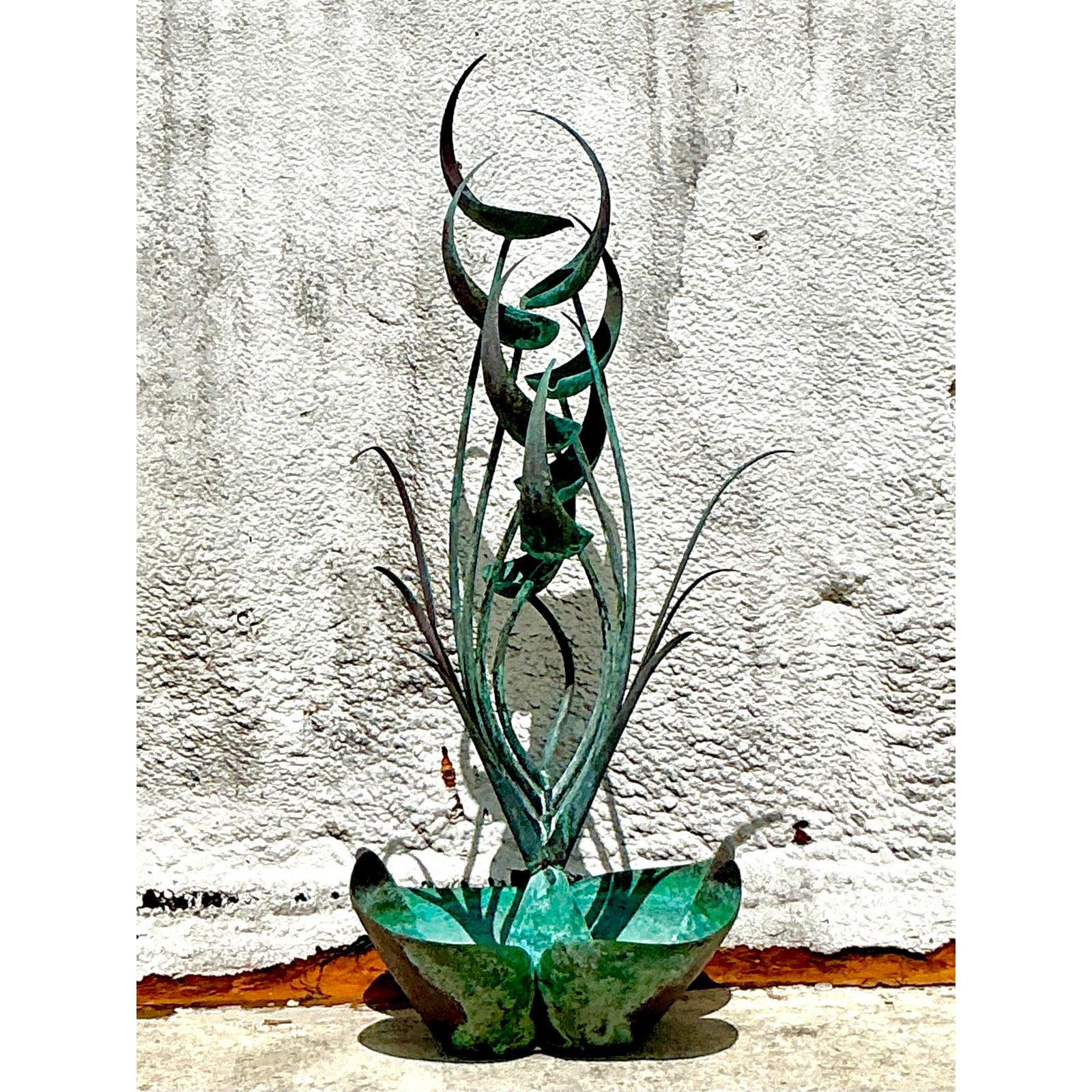 Embrace the tranquility and artistic flair of nature with this striking Vintage 1970s Verdigris Abstract Organic Fountain. This unique sculptural piece features an mesmerizing design of curving forms and upward-reaching elements, reminiscent of