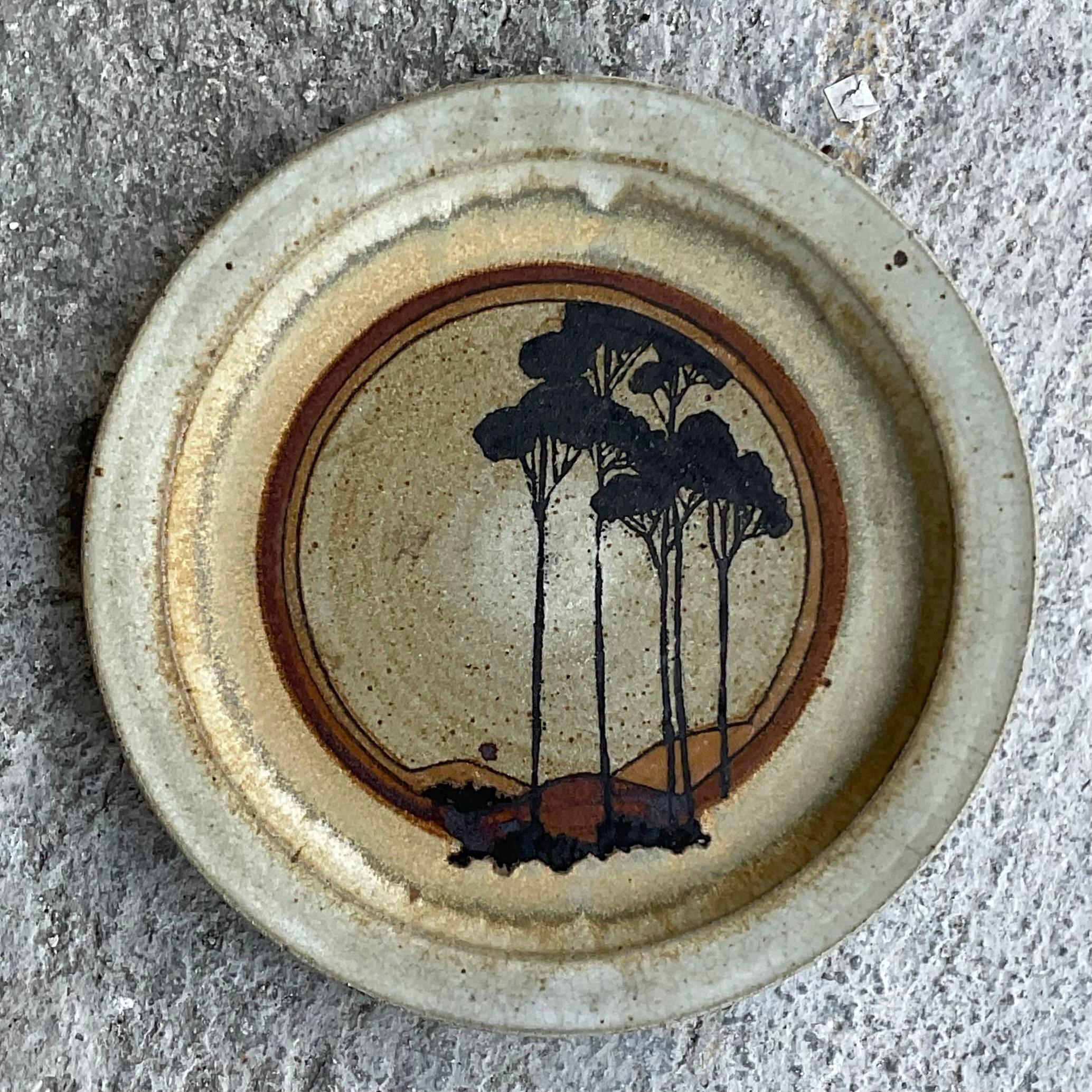 A fabulous vintage Boho studio pottery plate. Signed and dated 1974. A chic graphic compositions of trees. Super cool. Acquired from a Palm Beach estate 