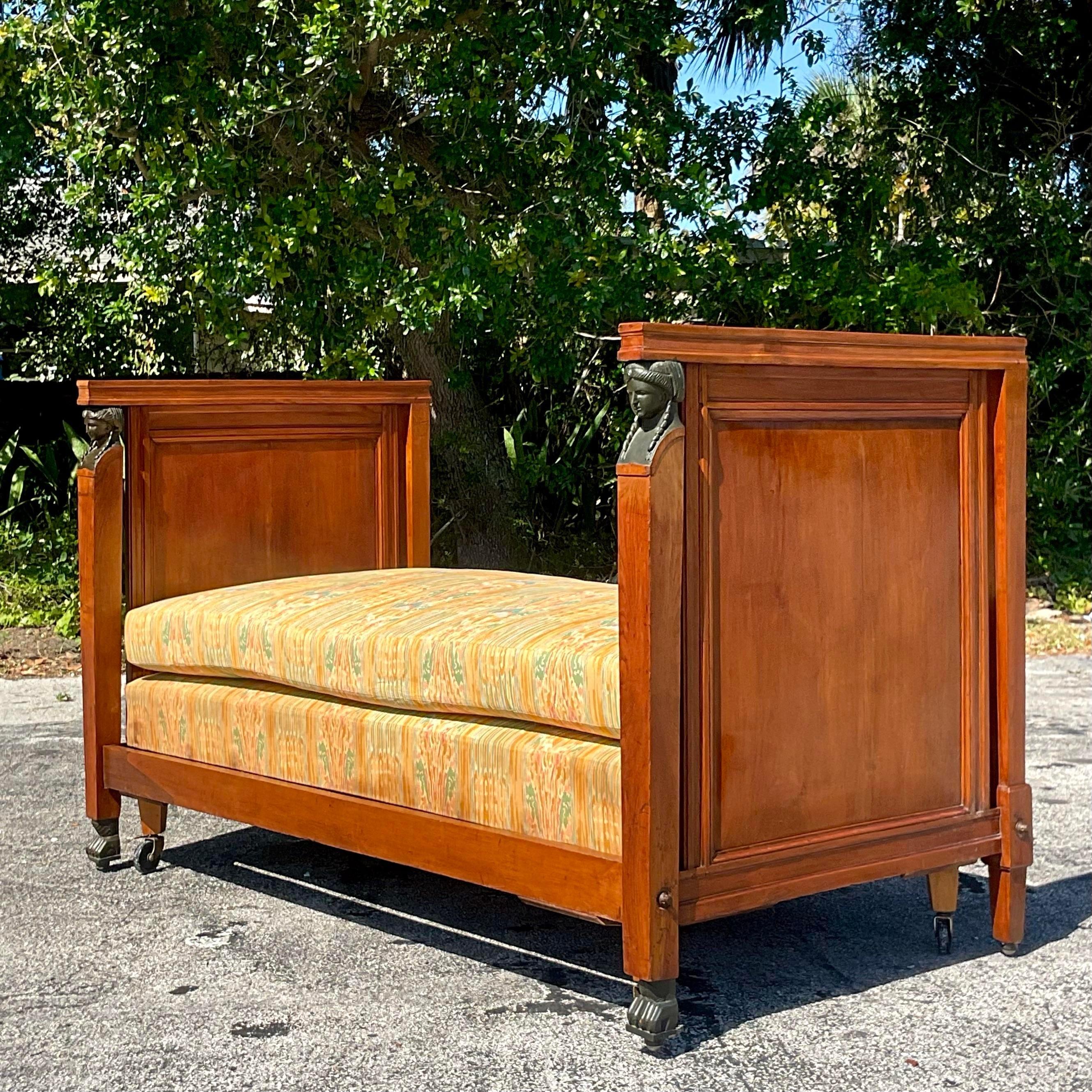 Experience vintage boho charm and European elegance with our 19th Century Austrian Walnut Biedermeier Trundle Bed. Imported with care and crafted to perfection, this exquisite piece seamlessly blends timeless design with bohemian flair. Embrace its