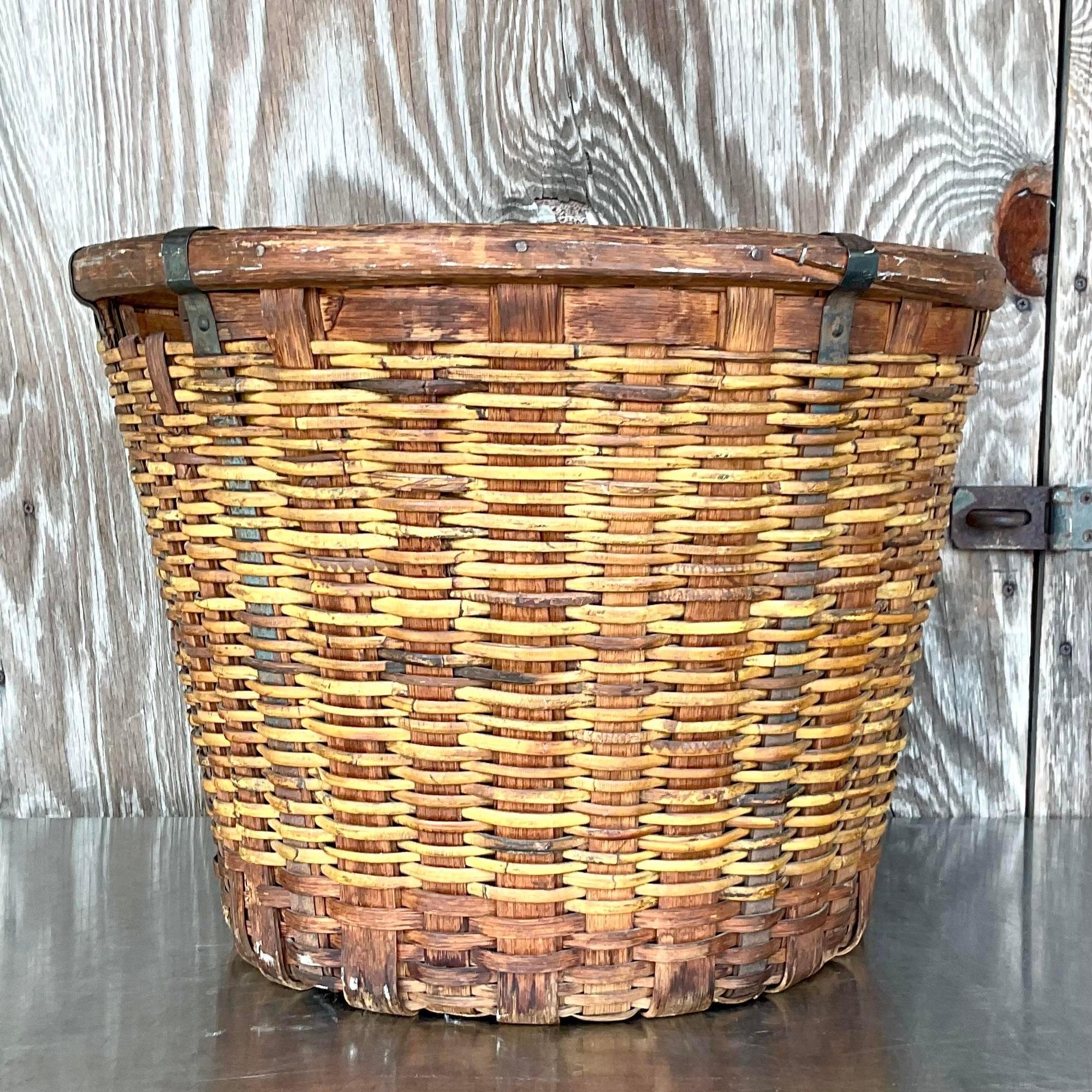A fantastic vintage Boho basket. A chic French design with metal ribs and woven rattan. An absolutely stunning basket. Acquired from a Palm Beach estate.