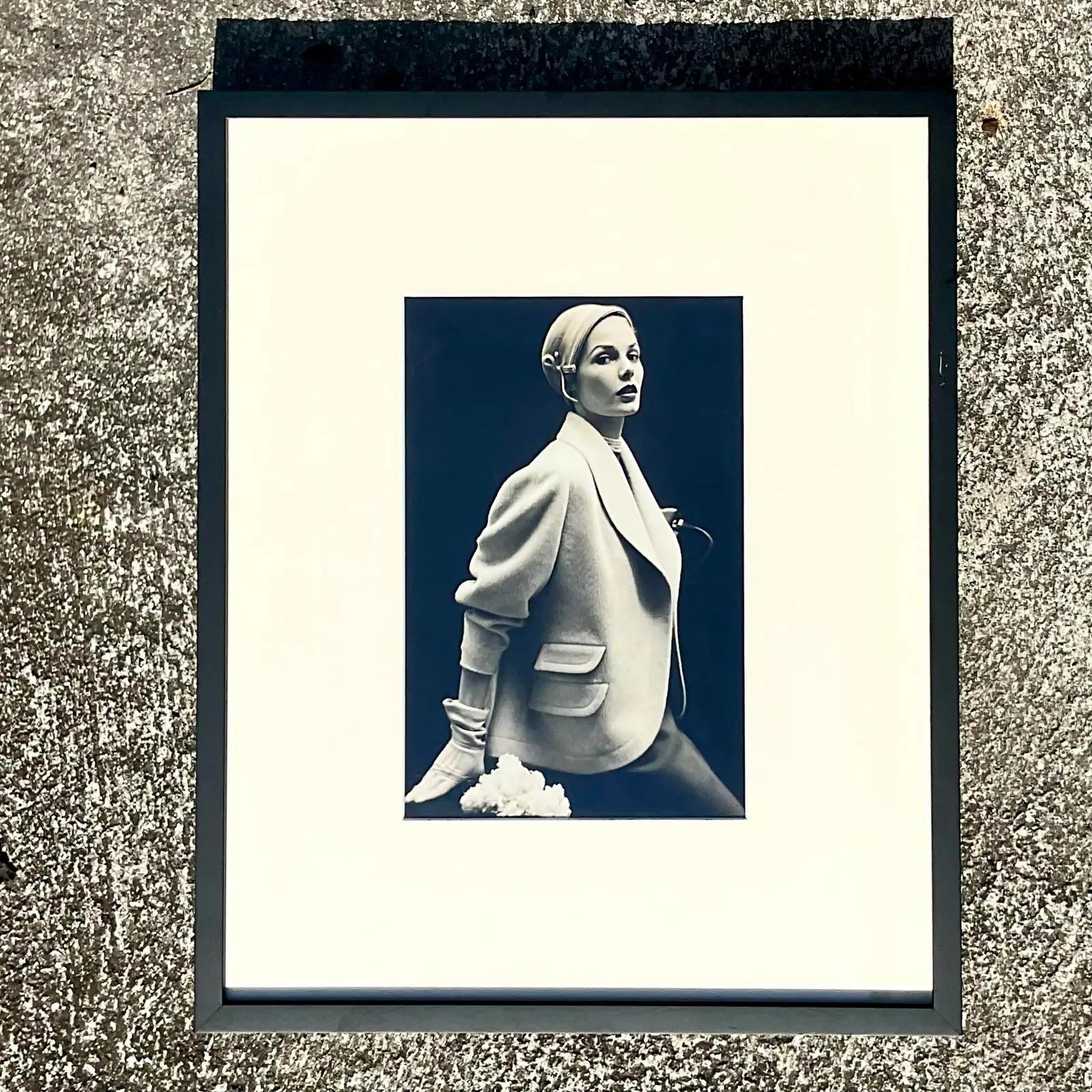 A fantastic vintage Framed photograph. A chic fashion photo in black and white. Newly framed in a chic and simple black frame and white mat. Acquired from a Palm Beach estate