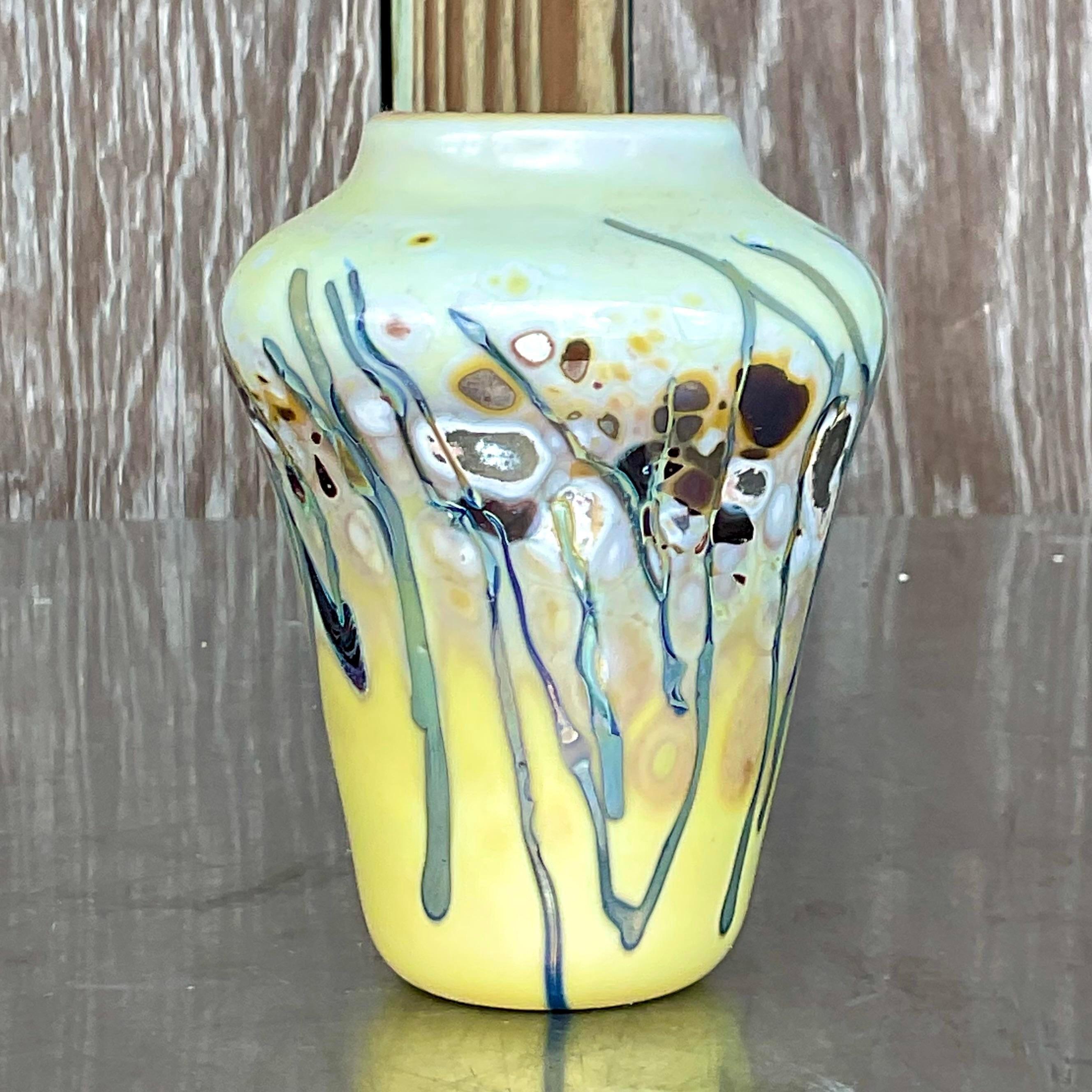 A stunning vintage Boho vase. A chic abstract composition rendered in glass. Beautiful pale coloration. Acquired from a Palm Beach estate.