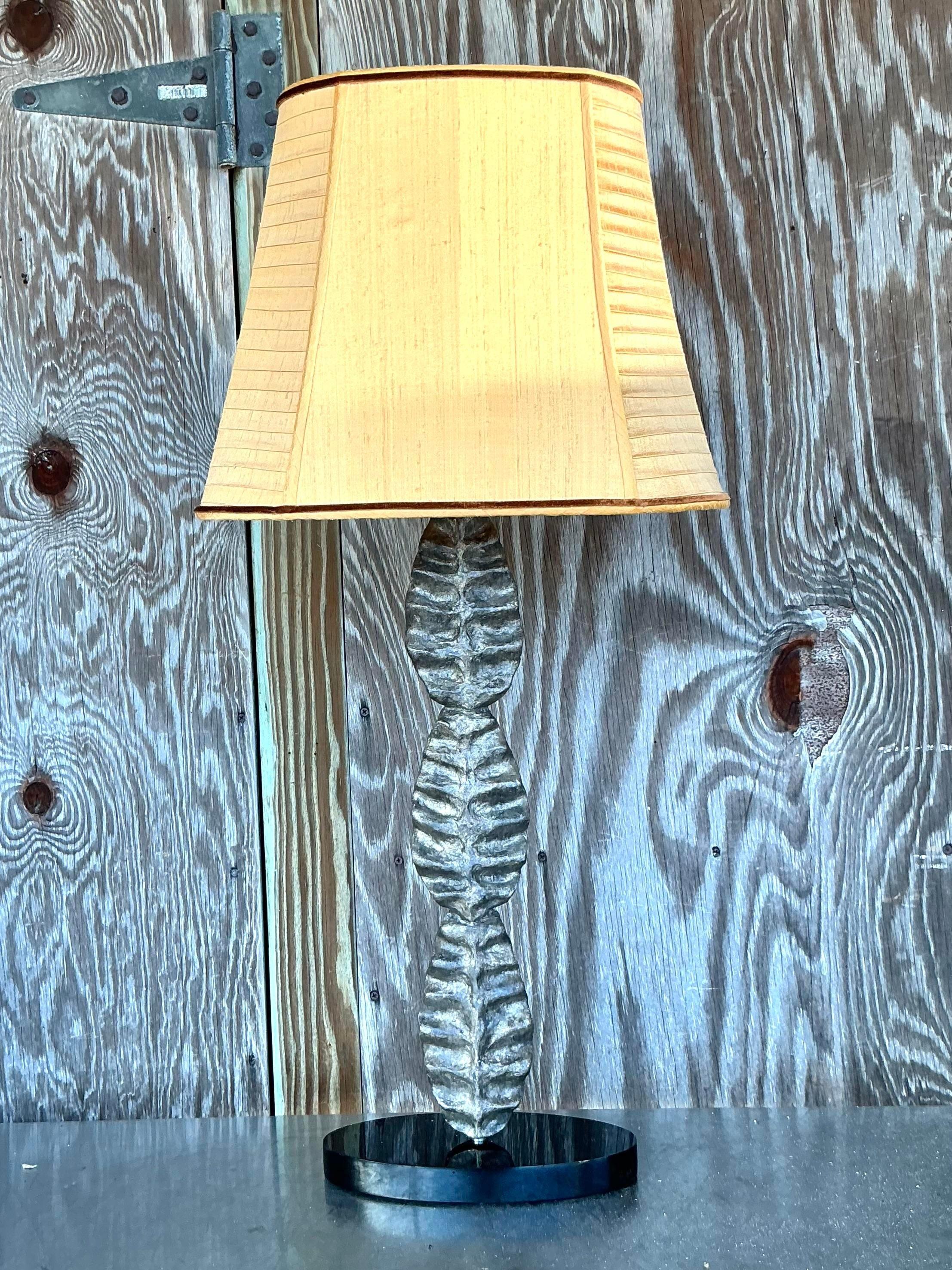 Infuse your space with artistic elegance through this Vintage Boho Abstract Molded Leaf Lamp. Featuring a beautifully sculpted leaf design, this lamp exudes organic charm with its flowing, abstract form. The intricate molded detailing captures the