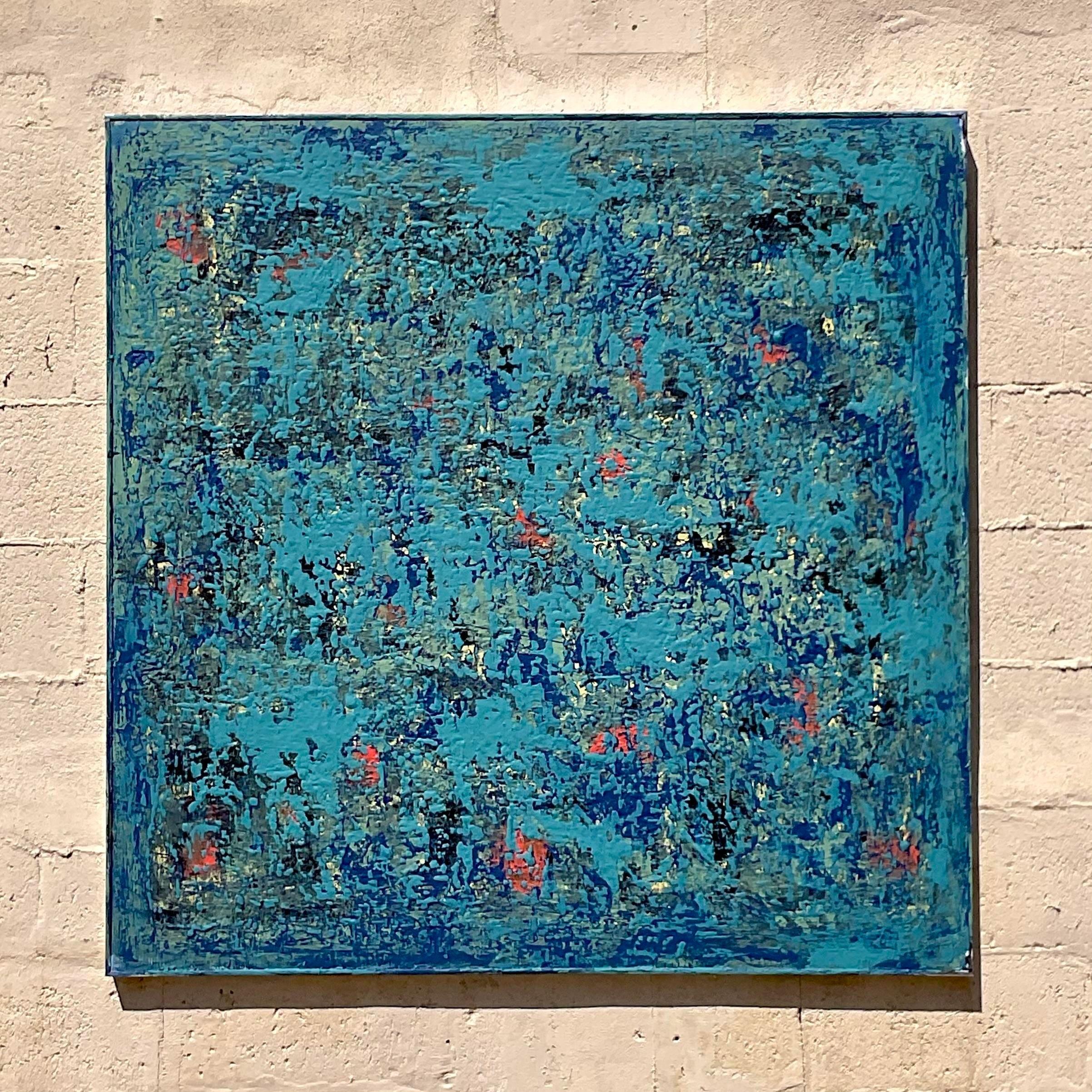 This vintage abstract oil on canvas is a gorgeous sky blue with multiple shades of blue and hints of coral hidden within. The thick coat of paint shows the time the piece took to create and adds a 3rd dimension. Acquired from a Palm Beach estate.