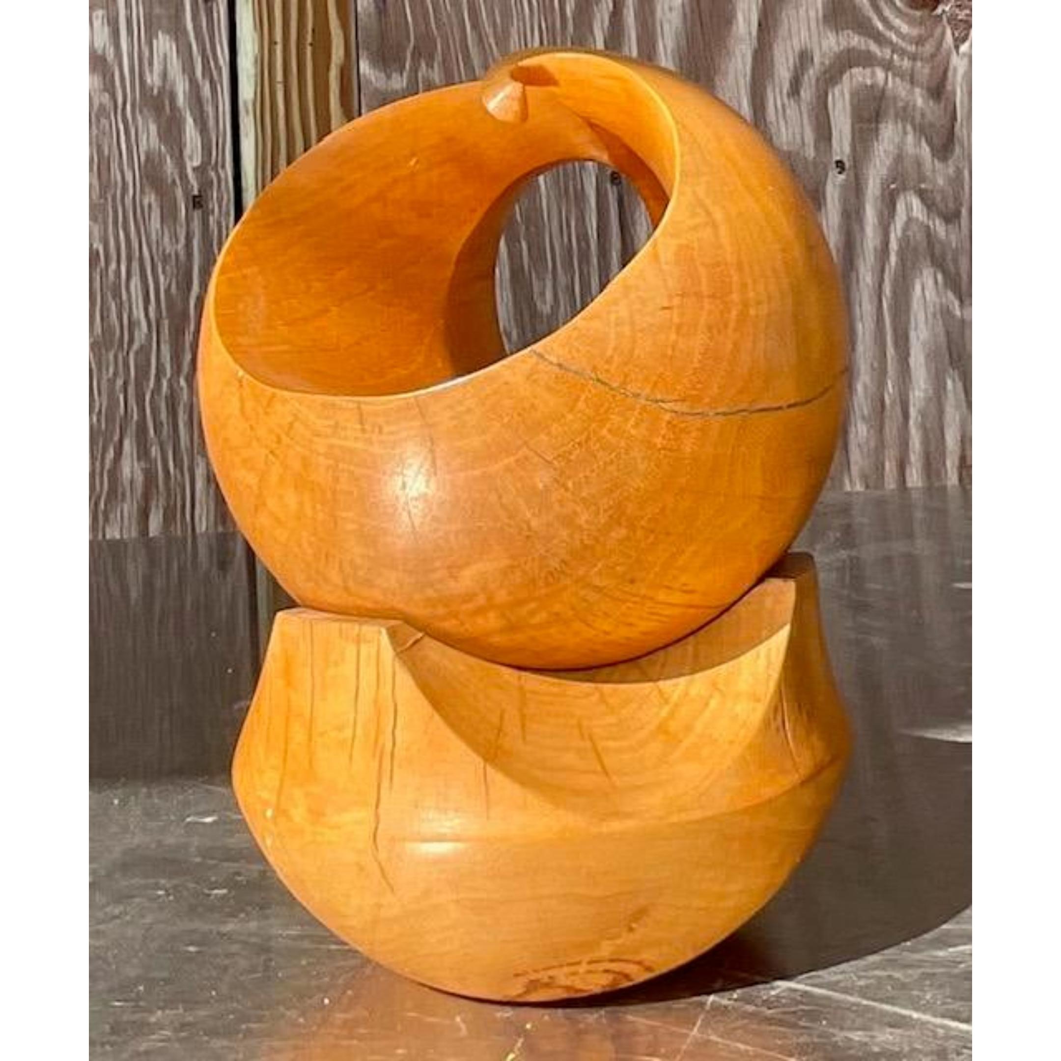 A fantastic vintage Boho sculpture. A chic stack on hand carved wood sphere and cradle. Turn the sphere to car pure different looks. Acquired from a Palm Beach estate.
