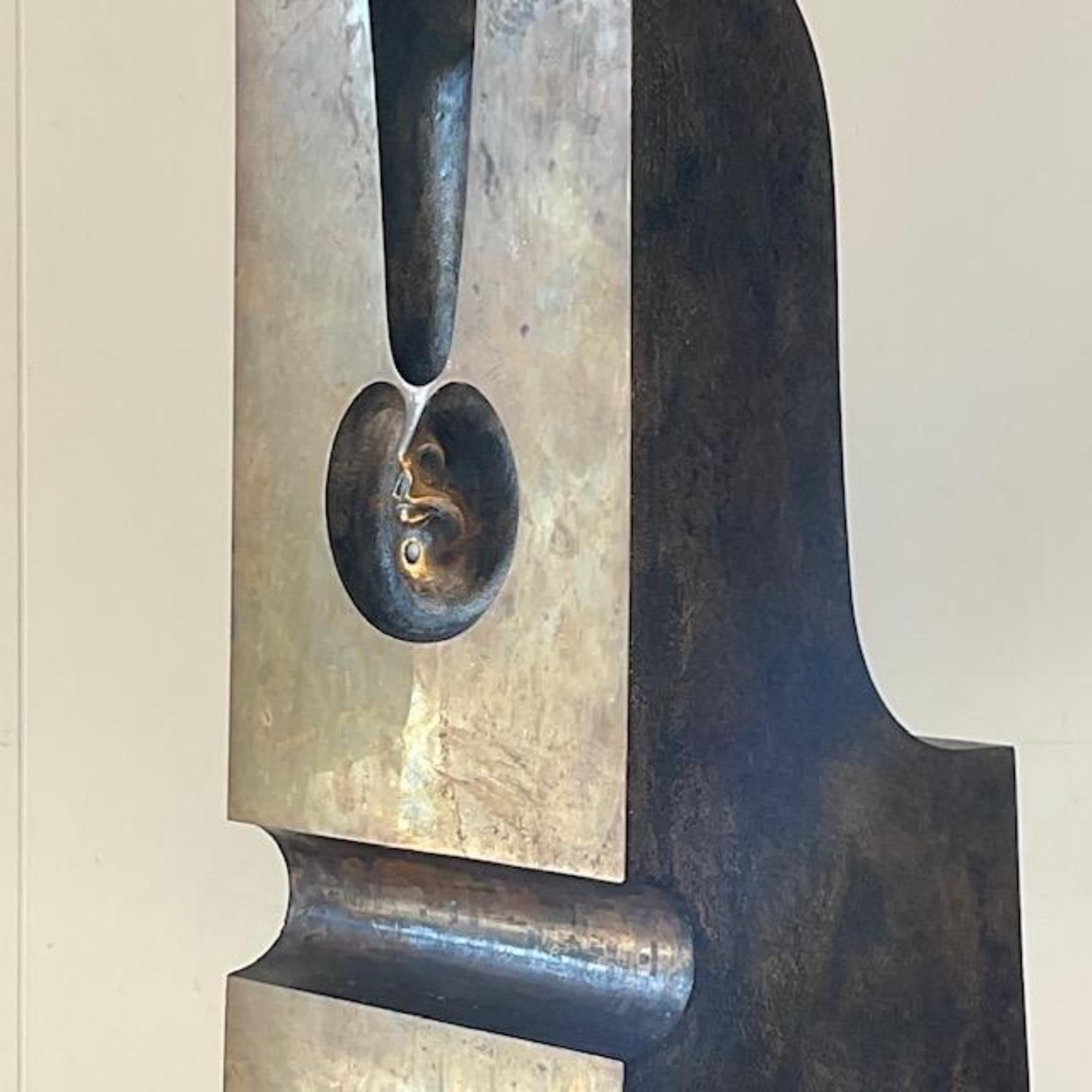 A fantastic vintage Boho bronze sculpture. An amazing Surrealist Abstract design with a floating face in front. Stamped by the artist. Acquired from a Miami estate.