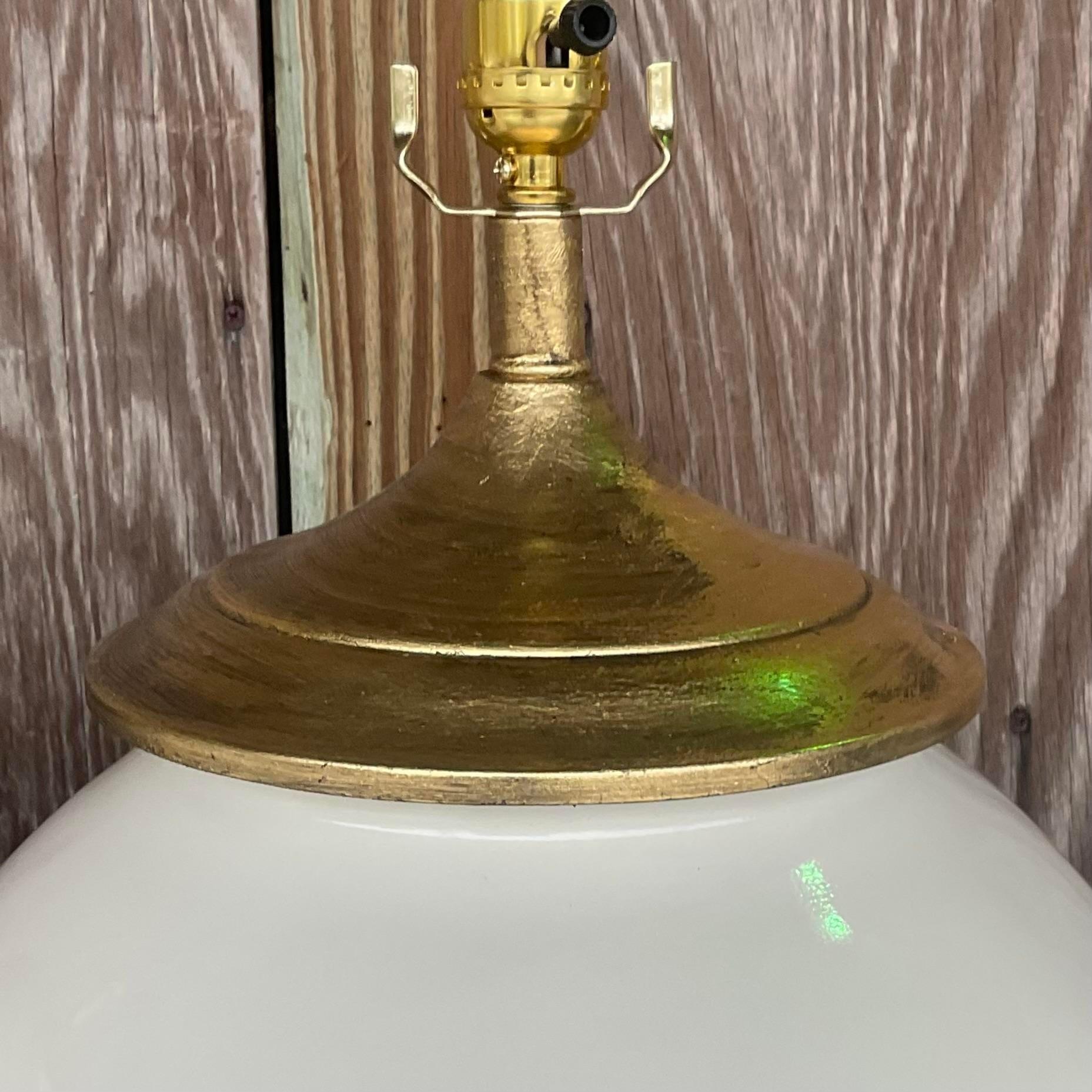 A fabulous pair of vintage table lamps. Made by the iconic Alsy group and tagged on the plinth. Beautiful matte glazed ceramic with gilt plinth and cap. Fully restored with all new wiring and hardware. Acquired from a Palm Beach estate.