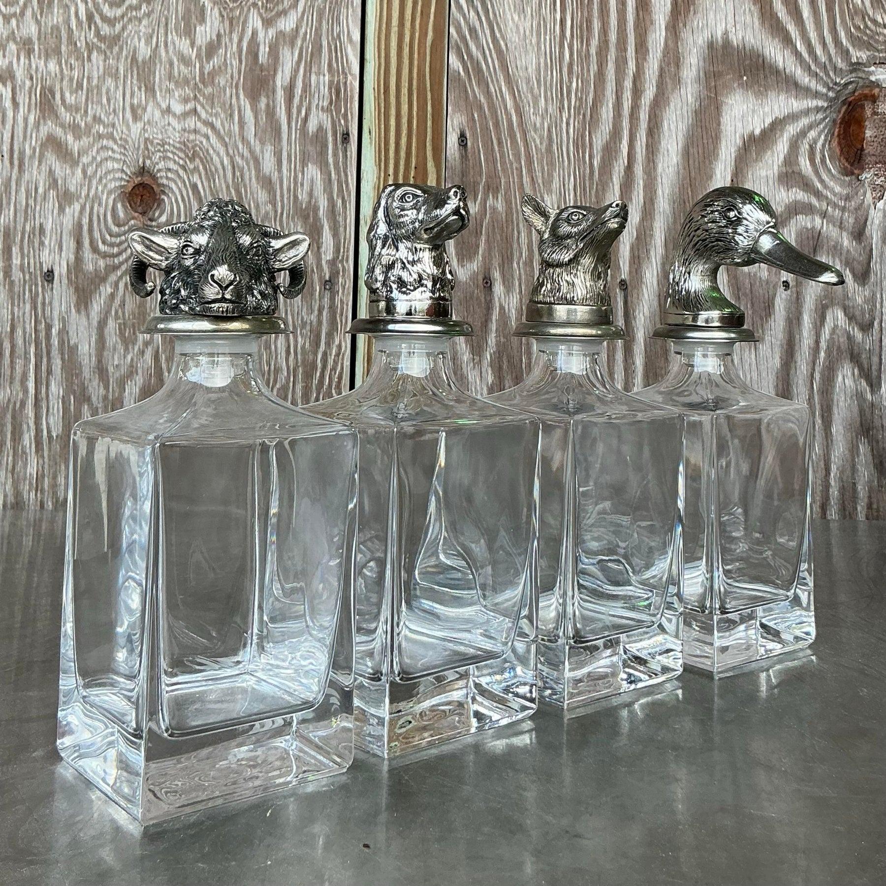 Embrace eclectic style with this vintage boho animal head decanter set of four. Each decanter features a unique, intricately detailed animal head, bringing a whimsical and artistic touch to your bar or dining area. Perfect for adding personality and