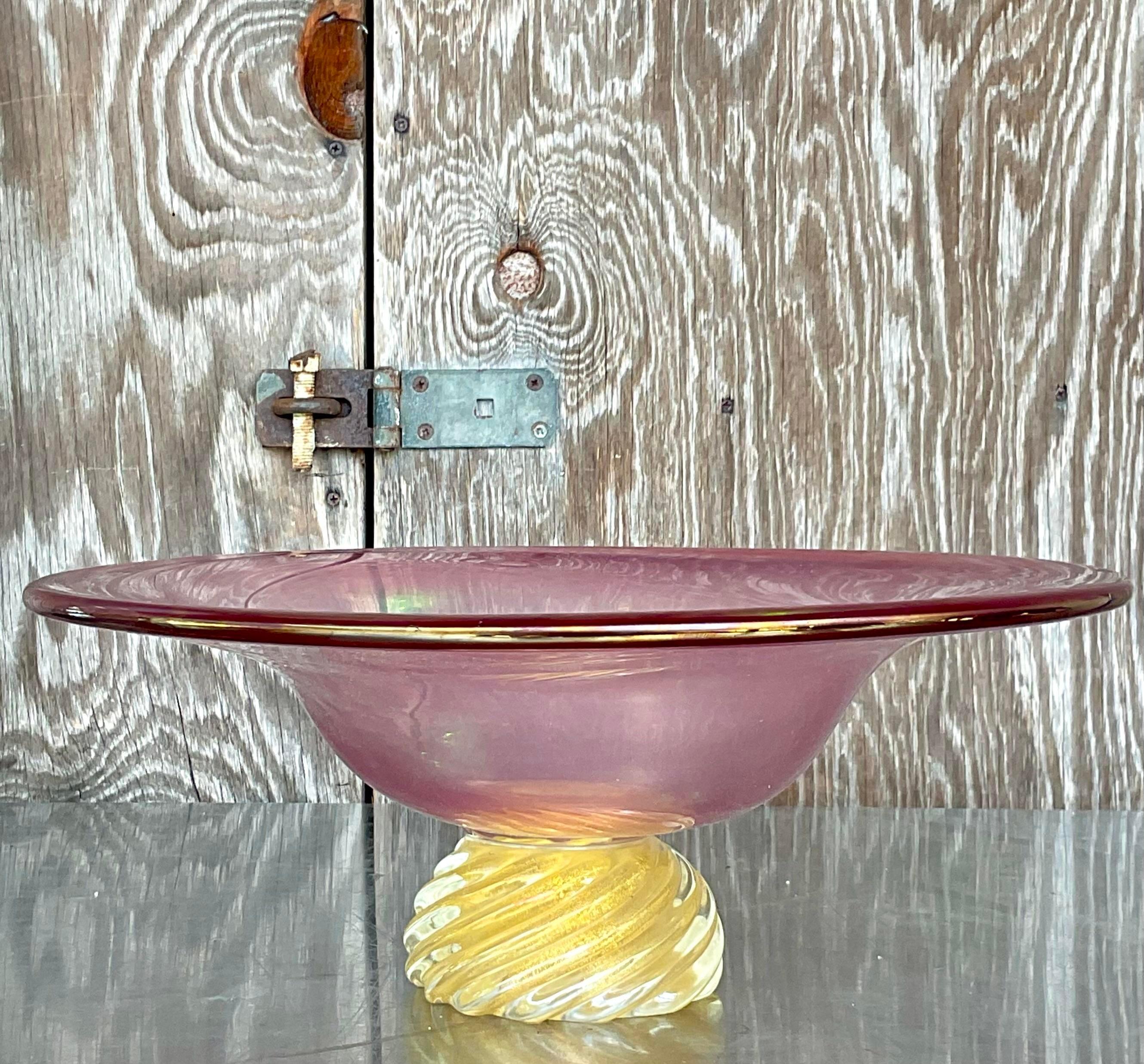 A fabulous vintage Boho Art glass bowl. Monumental in size and drama. A beautiful blown glass composition in a chic pink and gold combo. Acquired from a Palm Beach estate.
