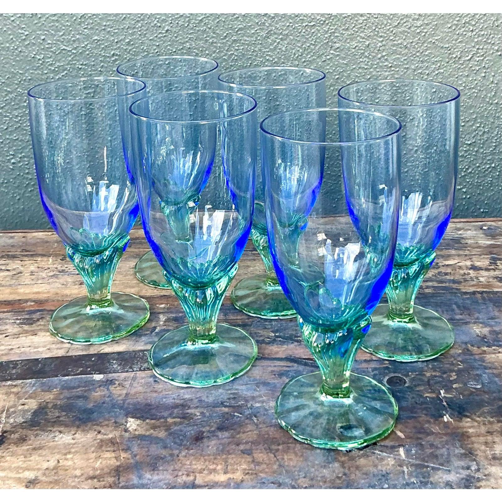 Elevate your dining experience with this vibrant set of six vintage art glass goblets, a stunning example of Postmodern design exuberance. Featuring a captivating bi-color palette, each vessel showcases a tall, tapered bowl that transitions from a