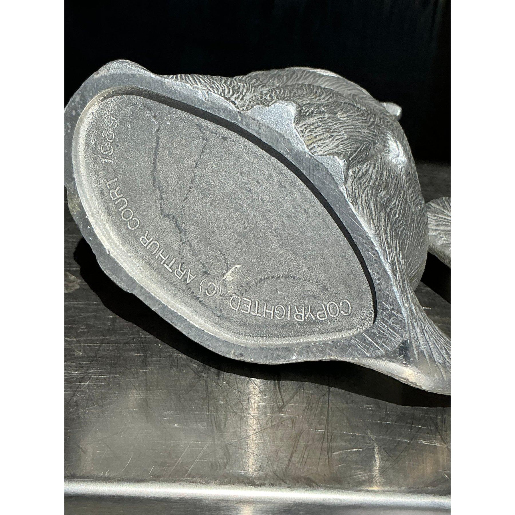 Elevate your serveware collection with this captivating vintage Arthur Court howling wolf pitcher. Showcasing the timeless craftsmanship Arthur Court is known for, this piece features a stunningly detailed howling wolf with textured fur and a