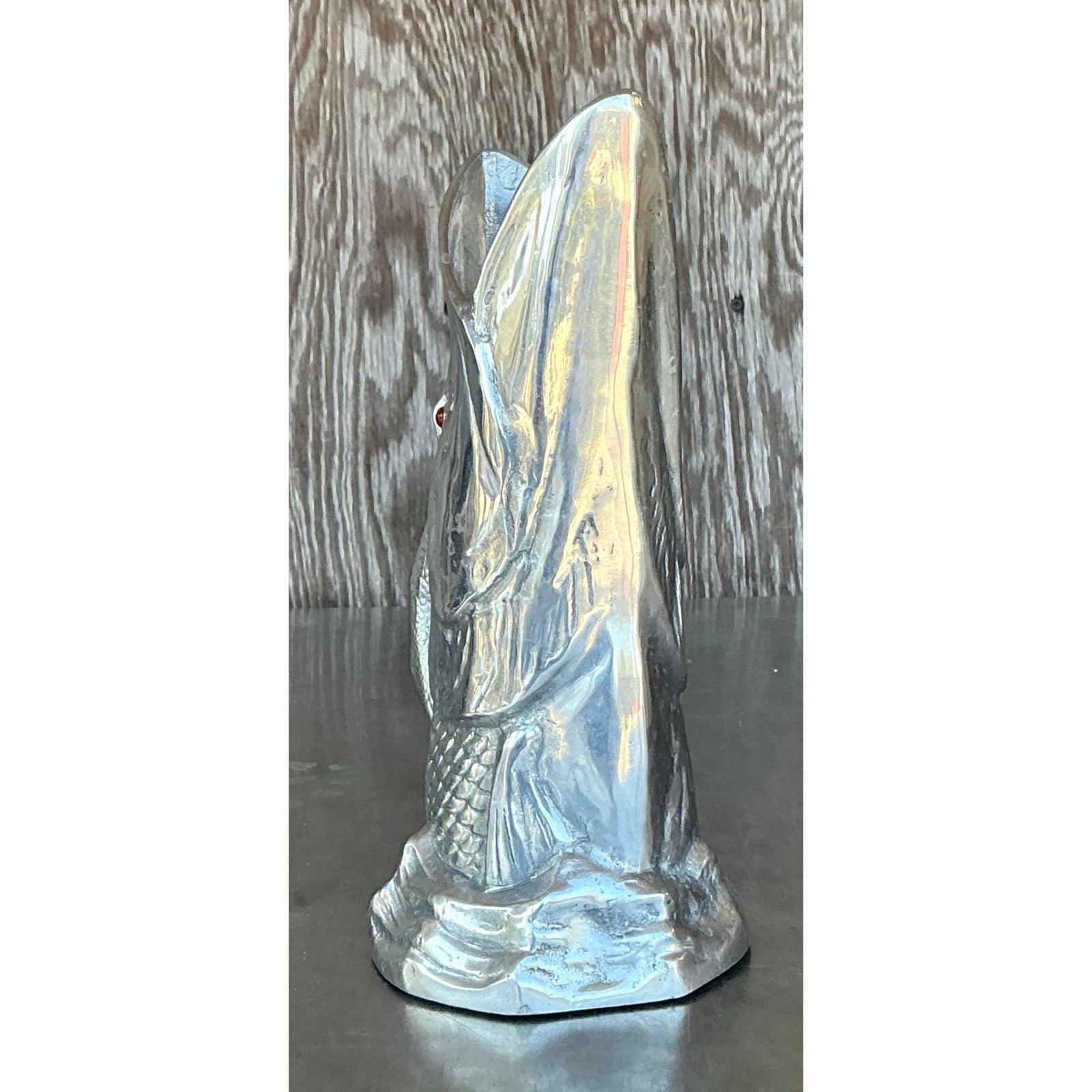 Dive into unique vintage charm with this iconic Arthur Court fish pitcher from 1977, a true embodiment of bold Boho and Coastal aesthetics. Crafted with Arthur Court's renowned attention to detail, this sculptural piece takes the form of a striking