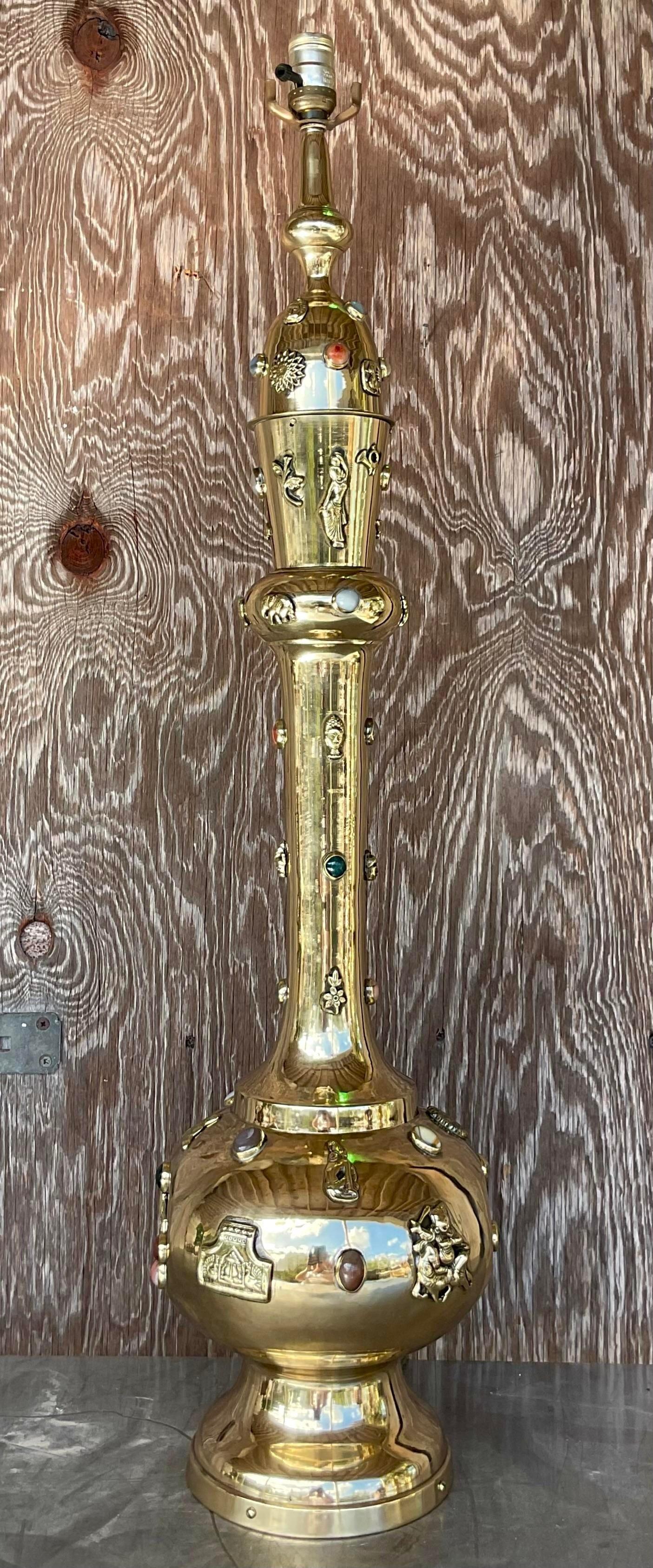 An incredible vintage Boho table lamp. Monumental in size and drama. A chic tall gourd shape with hand hammered details and inset precious stones. Also lights from the inside to really feature the different colored stones. Freshly polished. Acquired