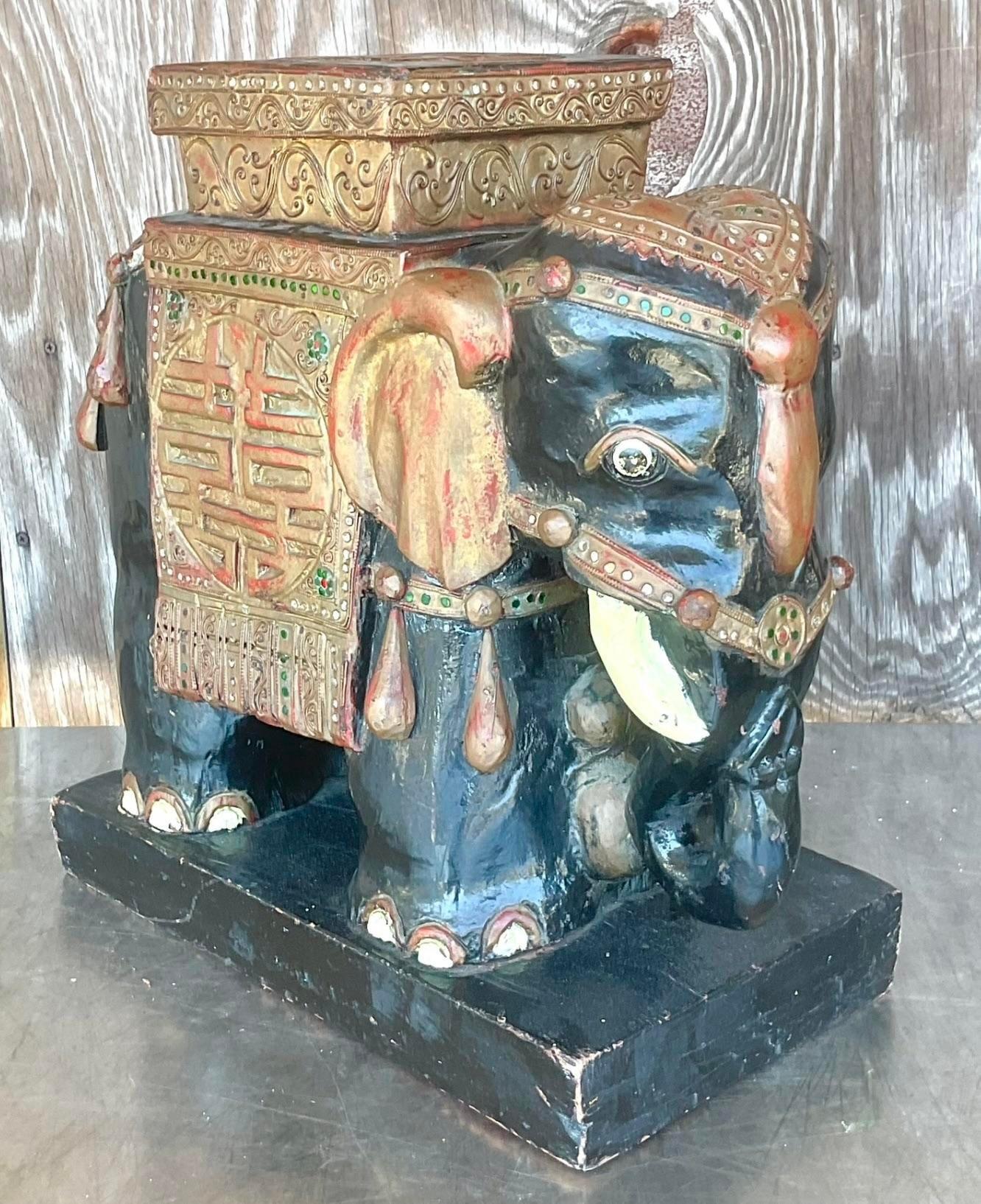 A handsome Boho carved wooden elephant. A much older piece with gorgeous all over patina from time. Small area of hand set s jewels add to the look. Acquired from a Palm Beach estate.