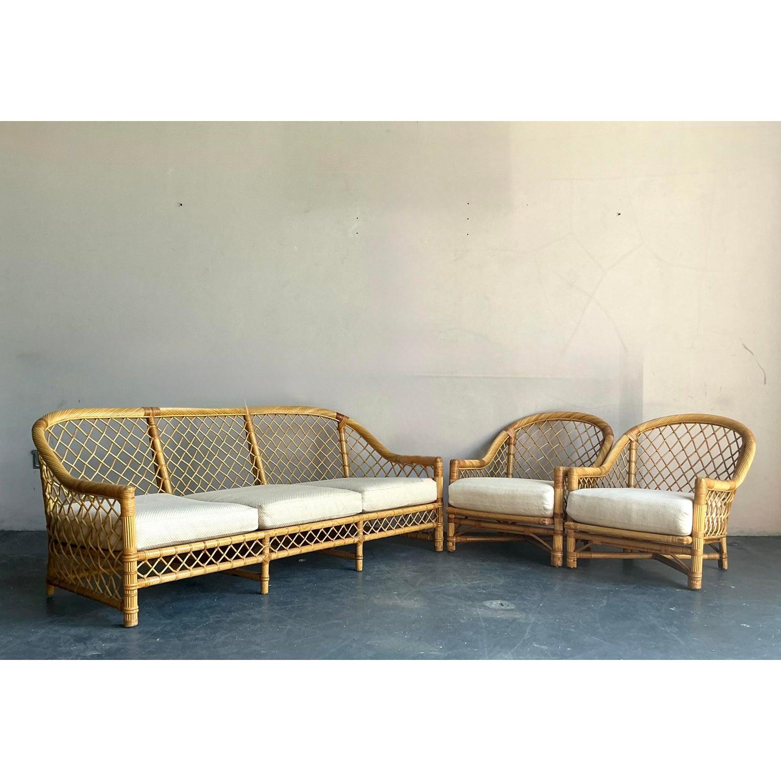Experience the pinnacle of rattan craftsmanship with this exquisite vintage sofa by the esteemed American maker, Bielecky Brothers. Celebrated for their legacy of quality, this piece features a stunning and intricate trellis-style frame,