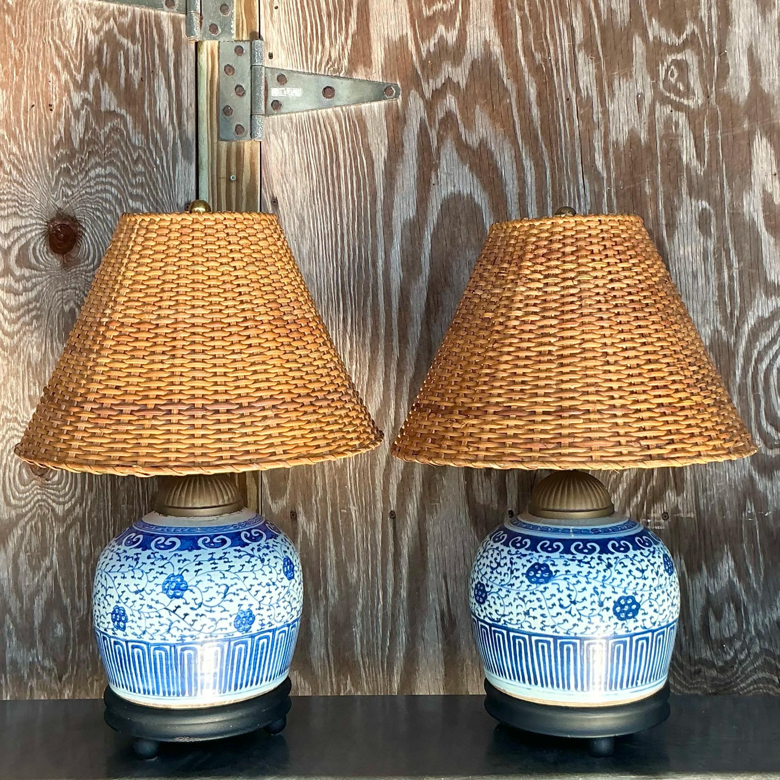 American Vintage Boho Blue and White Ceramic Lamps With Woven Rattan Shades - a Pair