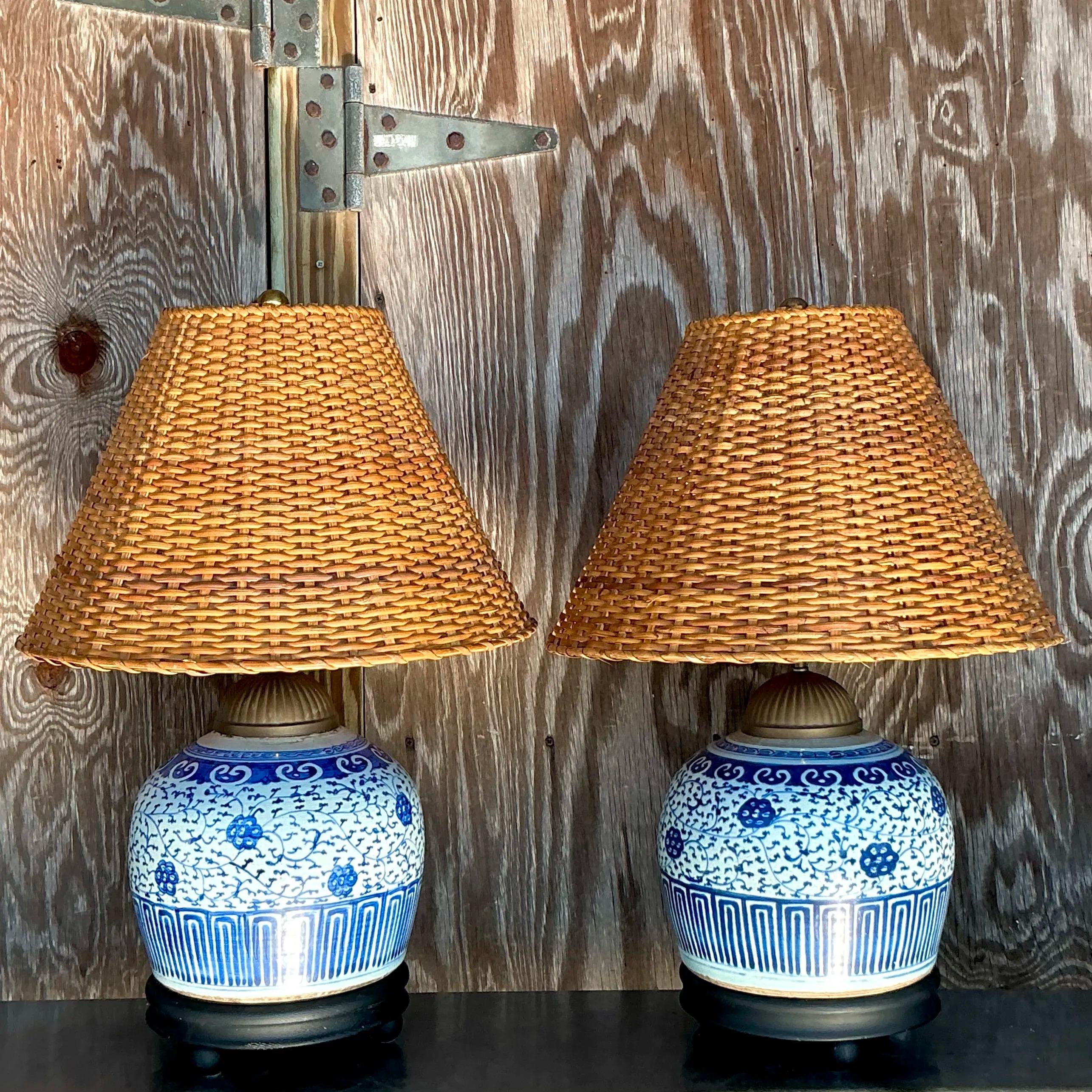 Vintage Boho Blue and White Ceramic Lamps With Woven Rattan Shades - a Pair In Good Condition In west palm beach, FL