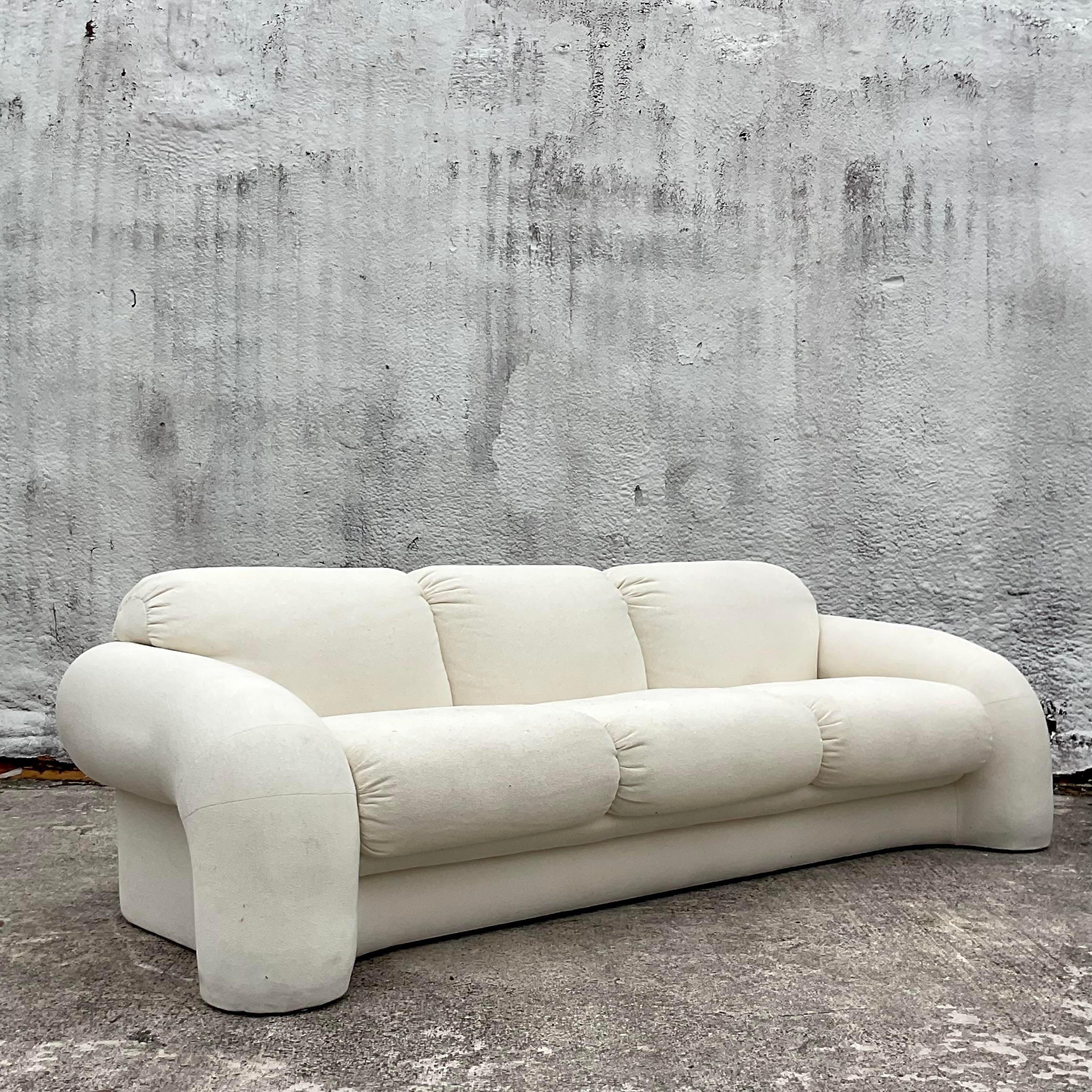 A fabulous vintage Boho boucle sofa. Done in the manner of Vladimir Kagan for Preview. Acquired from a Palm Beach estate