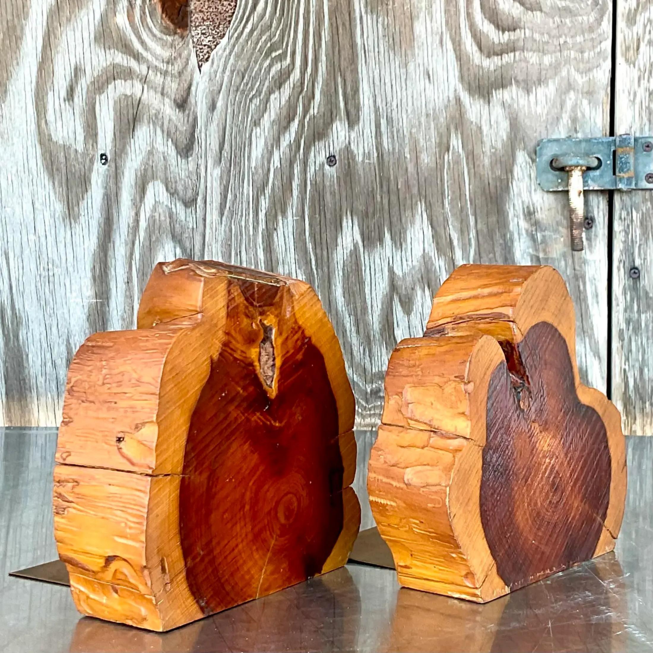 Fabulous pair of vintage Boho bookends. A chic rough cut cross section of a thick branch. Acquired from a Palm Beach estate.
