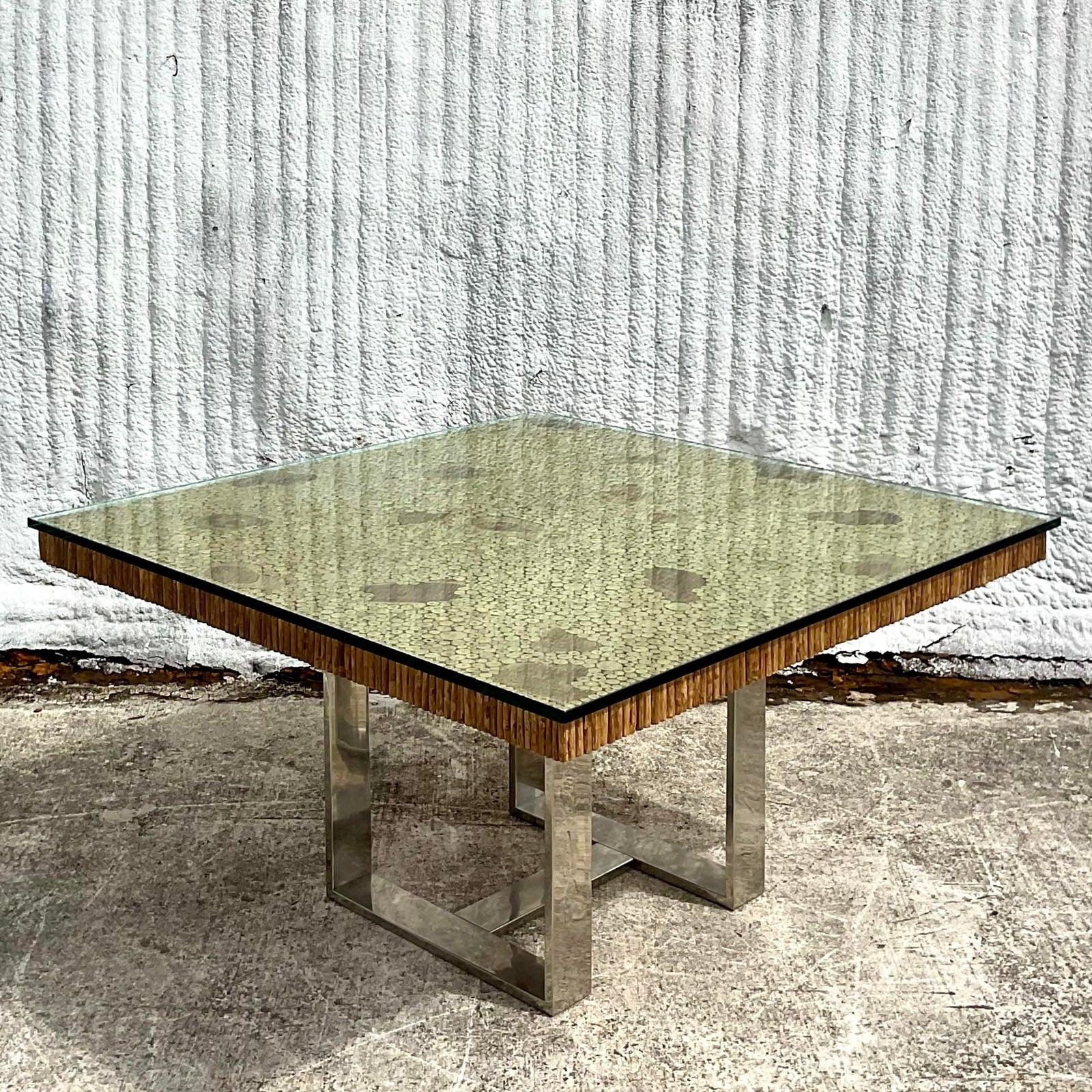 Incredible vintage hand cut branches dining table. Large surge face with individual slices of branches. Beautiful wood grain detail with a ring of branches along the edge. A super thick sheet of glass included. Rests on a flat bar polished chrome