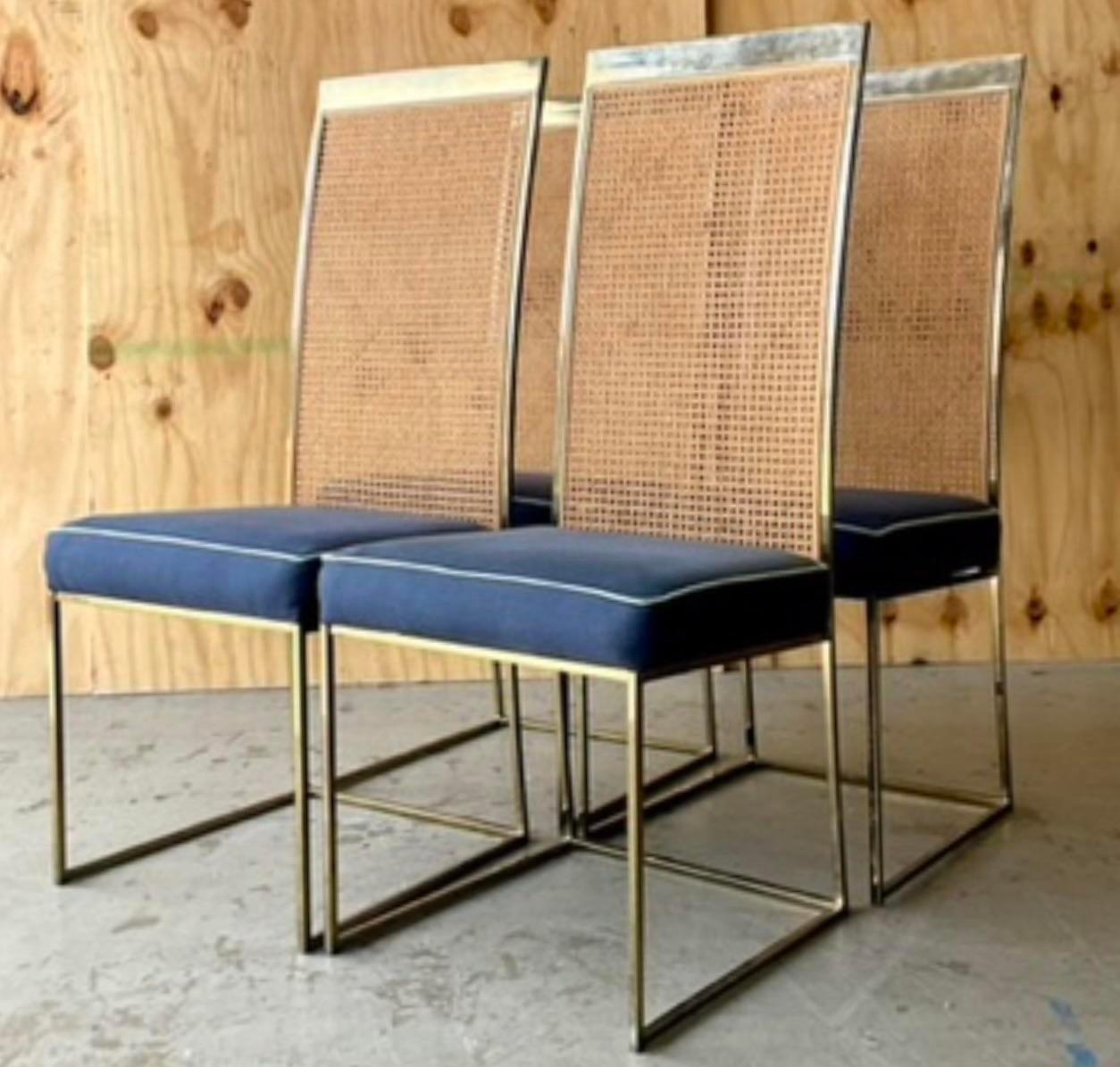 A fabulous set of four vintage Boho dining chairs. Beautiful brass frames with inset cane panels. Done in the manner of Milo Baughman for Thayer Coggin. I believe these are the real deal, but they lost their tags when reupholstered. All came in