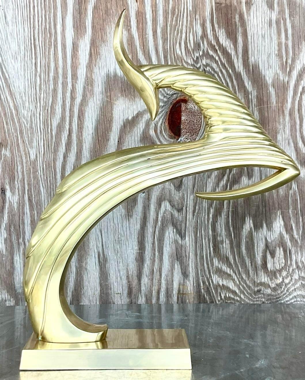 A stunning vintage a boho brass gazelle. A chic Art a deco style creature in a leaping motion. Acquired from a Palm Beach estate.