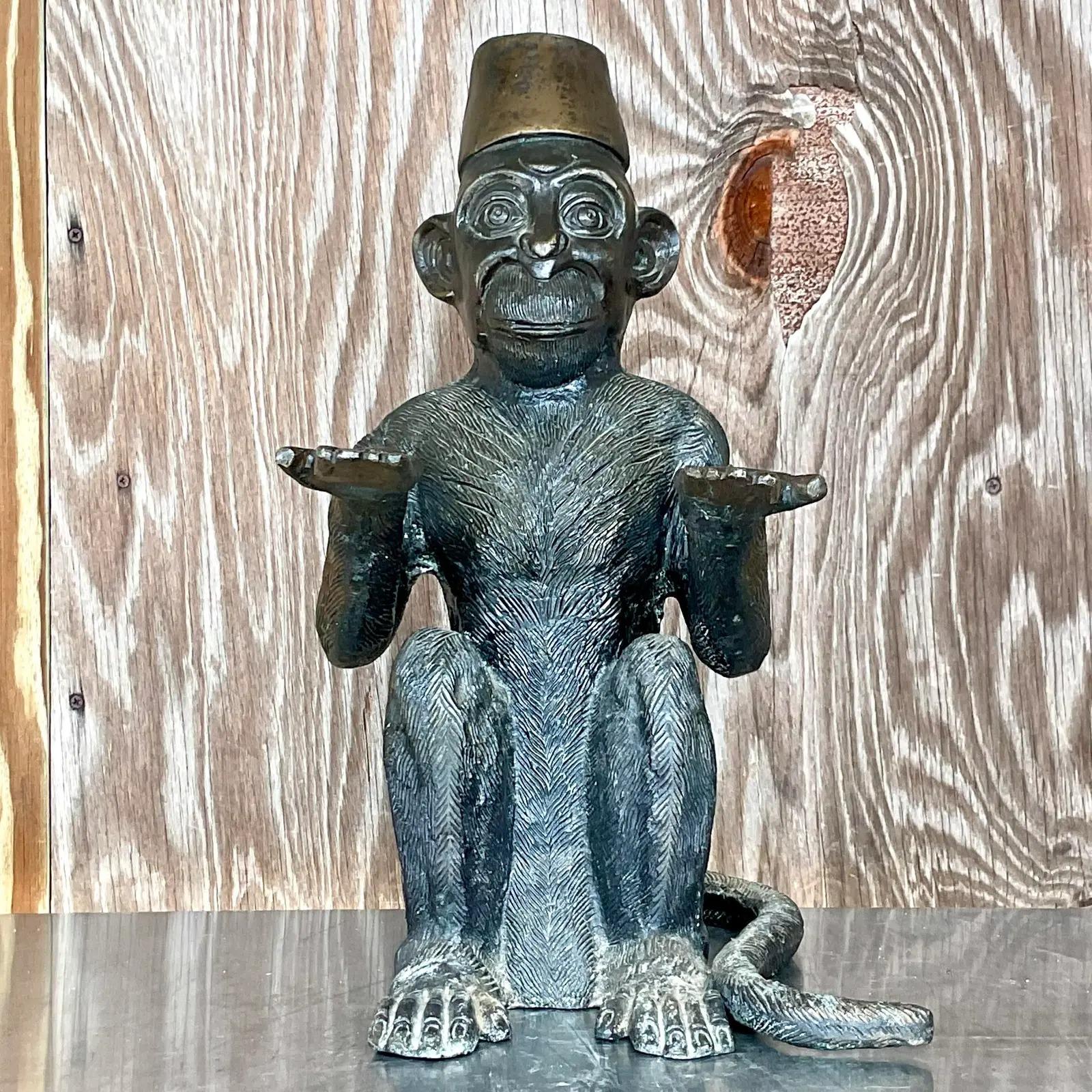 Fabulous vintage Boho bronze bellhop monkey. A charming little fella that is perfect for you to rest your tray. Perfect to collect your keys, place your treats or put your business cards! You decide! Acquired from a Palm Beach estate.