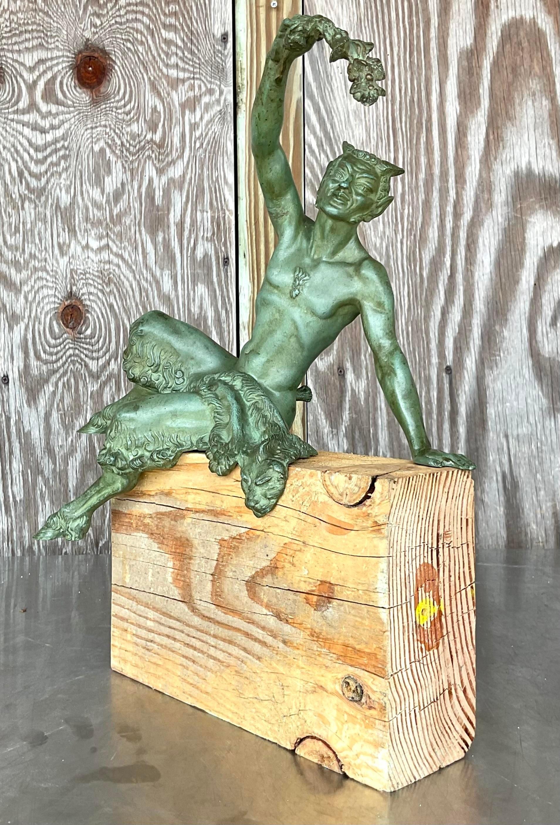 Enhance your space with the enchanting allure of this Vintage Boho Bronze Satyr Statue on Wood Plinth. Expertly crafted, the detailed bronze satyr exudes bohemian mystique, while the solid wood plinth adds a touch of classic American craftsmanship.