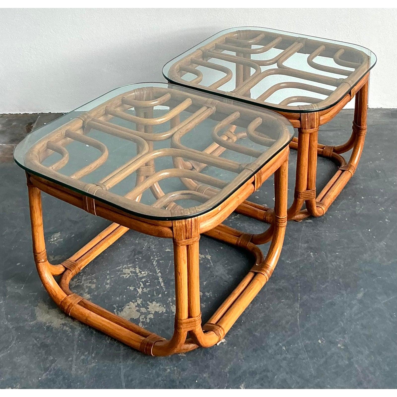 Bring the breezy sophistication of a Palm Beach resort into your home with this exquisite pair of vintage bent rattan side tables. Designed in the manner of Brown Jordan’s coveted 
