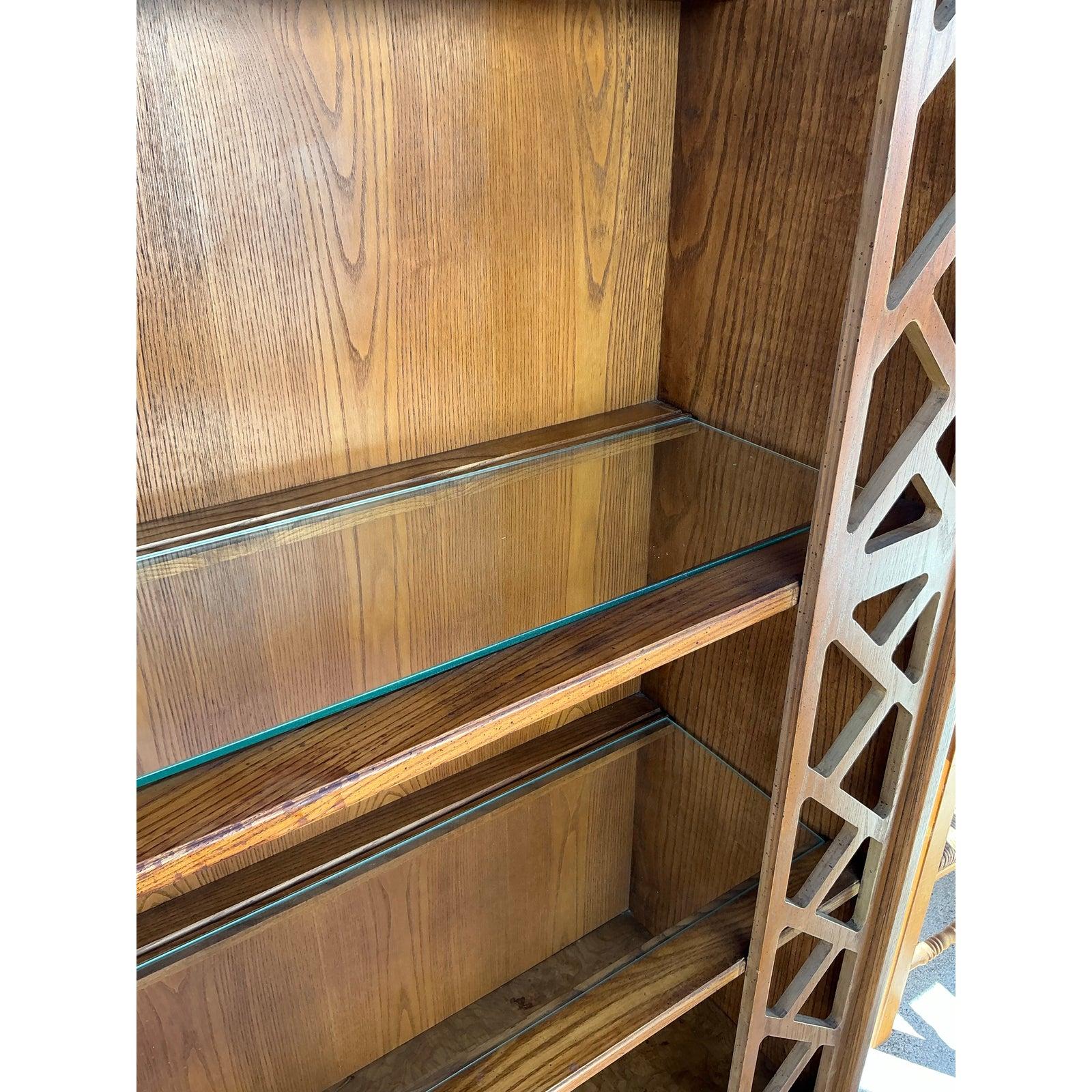 Add a touch of timeless sophistication to your space with this stunning pair of vintage boho burl fretwork etageres. Featuring intricate lattice fretwork along the sides, these open-shelving units provide a perfect balance of elegance and