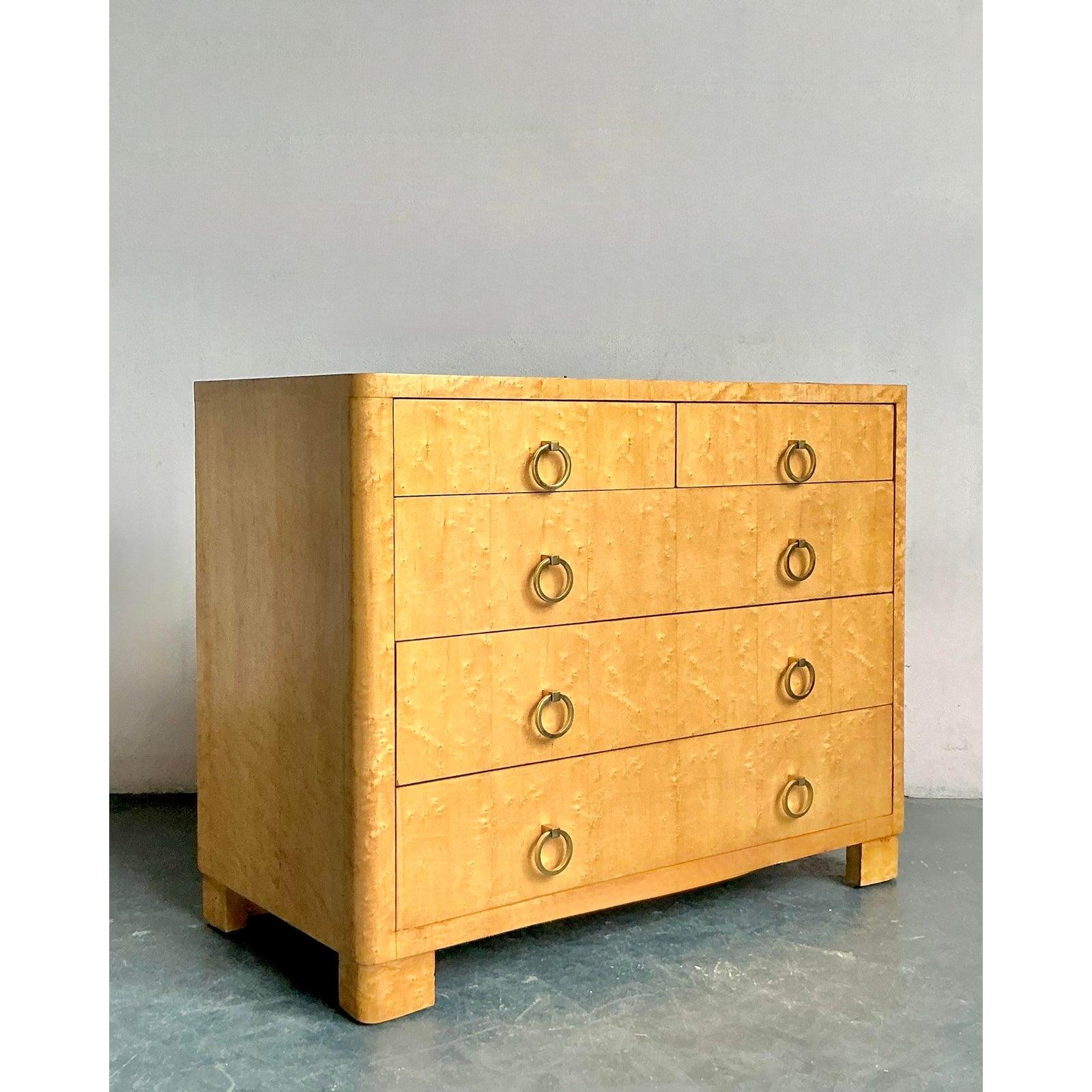 Presenting a stunning vintage burl wood chest of drawers, a piece that seamlessly blends rustic charm with modern elegance. The exquisite burl wood veneer showcases a mesmerizing, swirling grain pattern, making each surface a unique work of natural