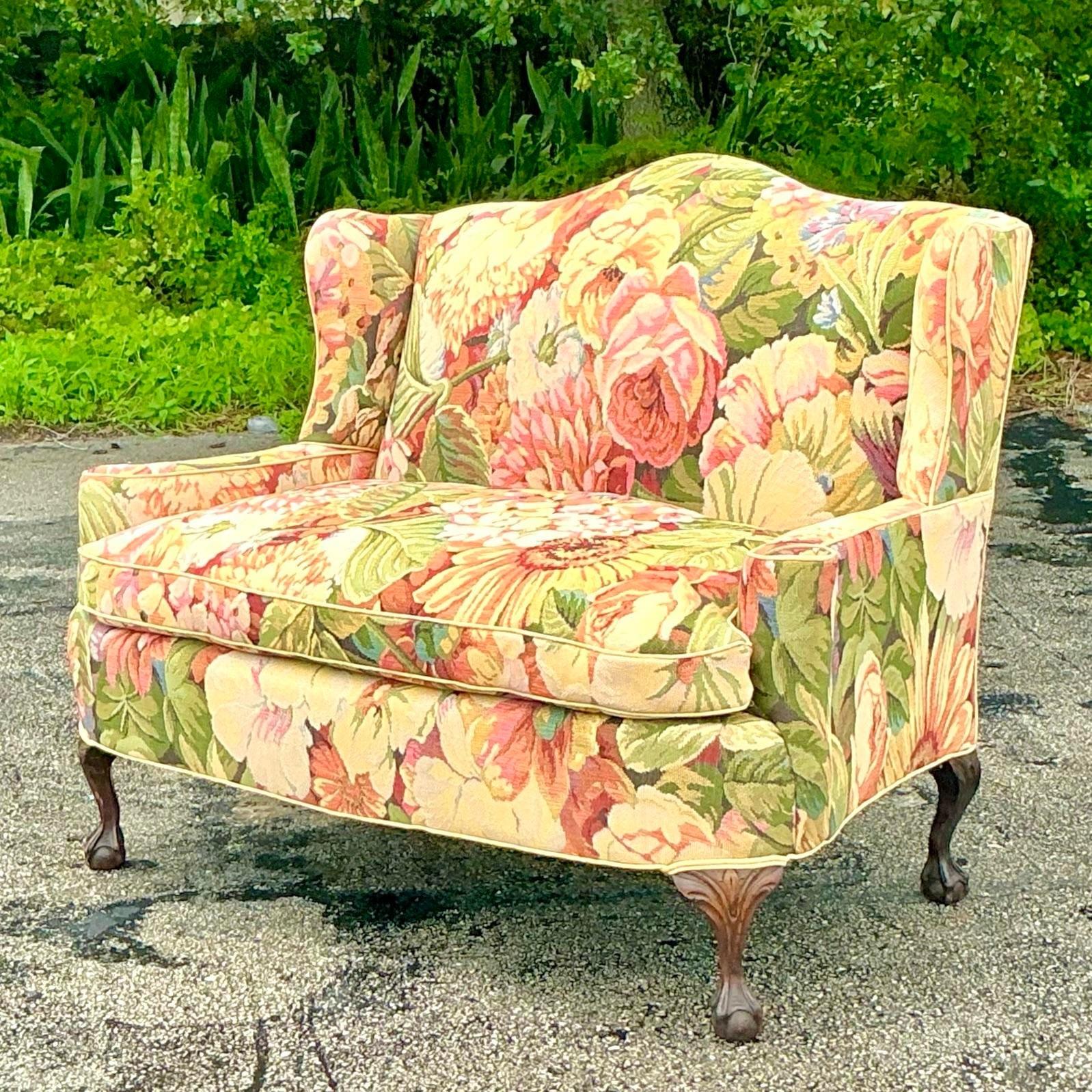 Bring timeless elegance and boho charm into your home with this vintage camelback loveseat upholstered in Brunschwig & Fils floral fabric. The graceful camelback silhouette is complemented by the vibrant, intricate floral pattern, making this piece