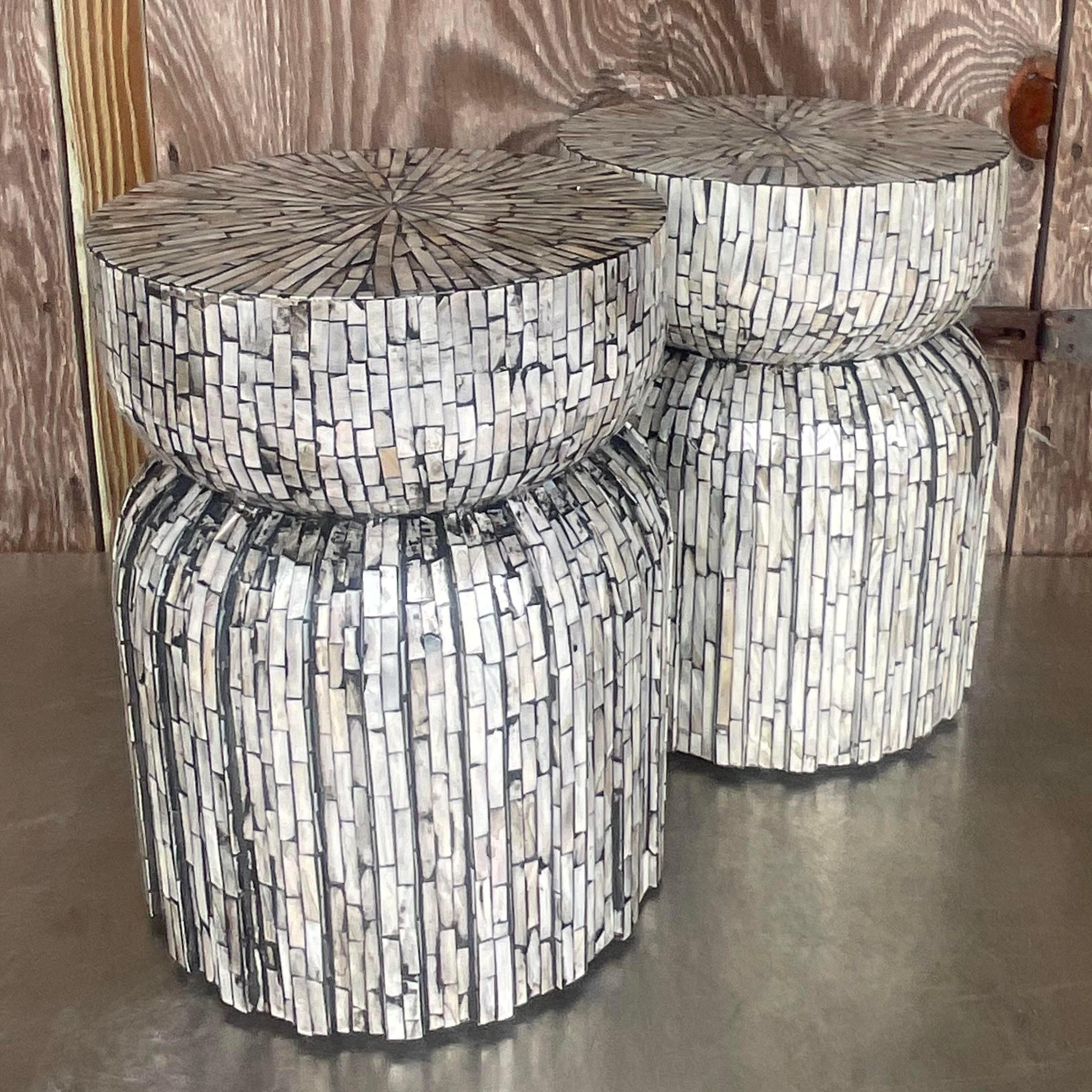 Add coastal charm to your space with this delightful pair of Vintage Boho Capiz Shell Low Stools. Crafted with natural Capiz shells and inspired by American beachside living, these stools bring a touch of relaxed elegance to any room. Perfect for