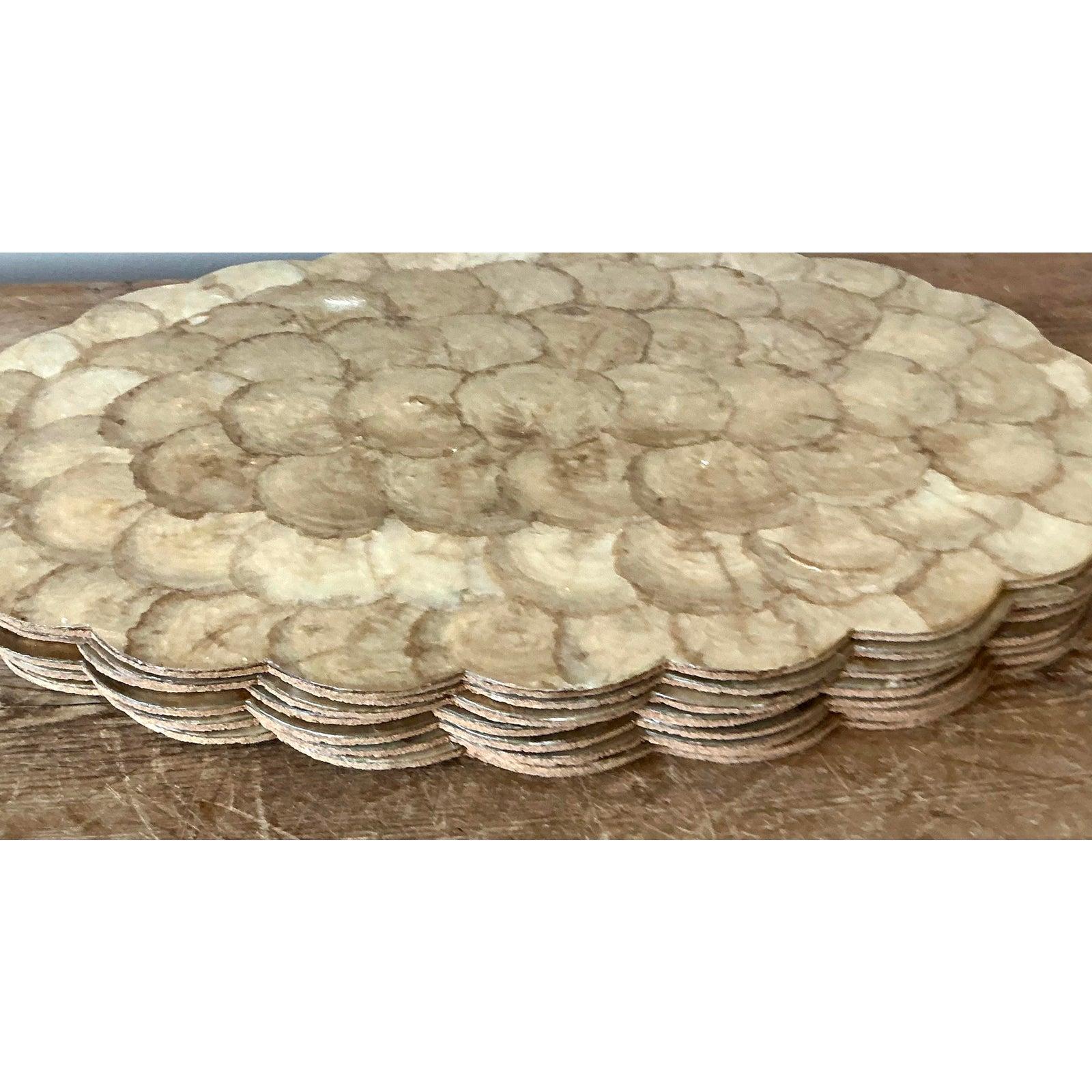 Imbue your dining experience with the iridescent beauty of the coast using this stunning set of eight vintage capiz shell placemats. Handcrafted from genuine windowpane oyster shells, each mat features an overlapping 
