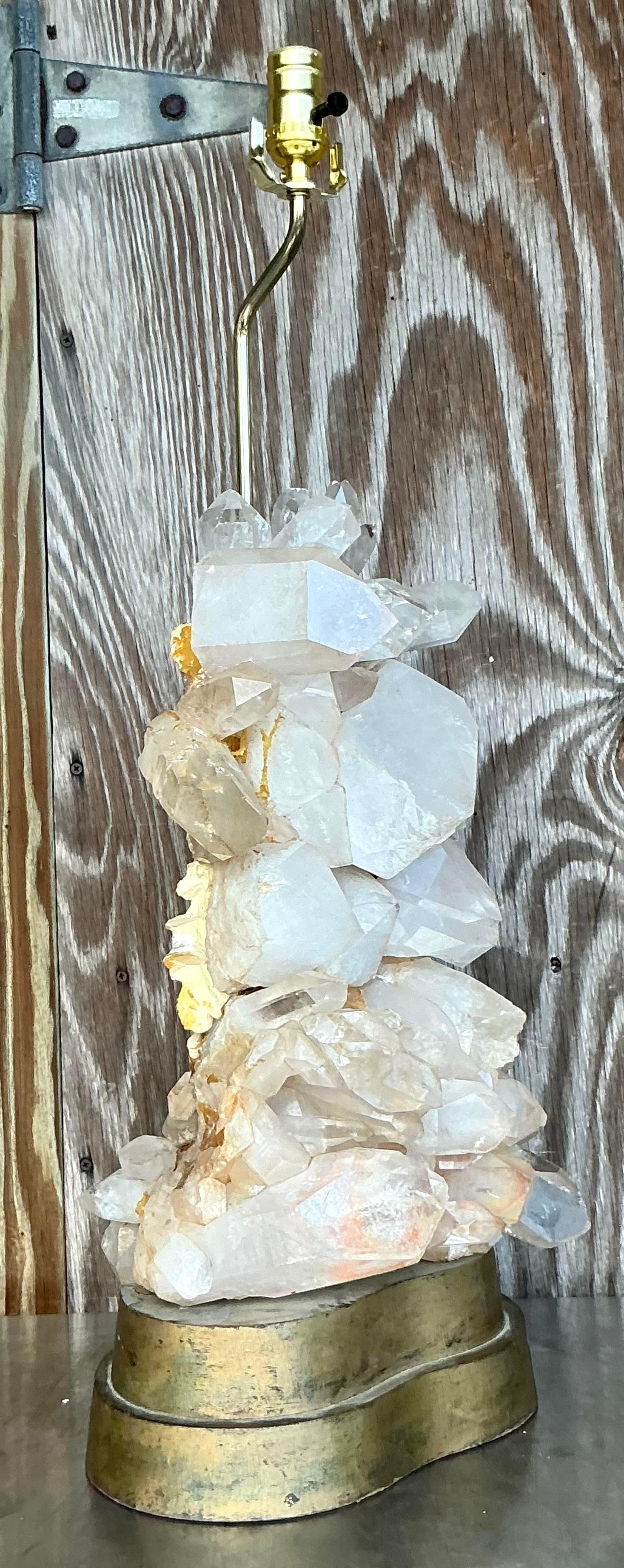 Brighten your space with this exquisite vintage Boho Carole Stupell crystals lamp. Adorned with sparkling crystals and a unique design, this lamp effortlessly combines elegance with bohemian flair. The soft glow it emits creates a warm and inviting