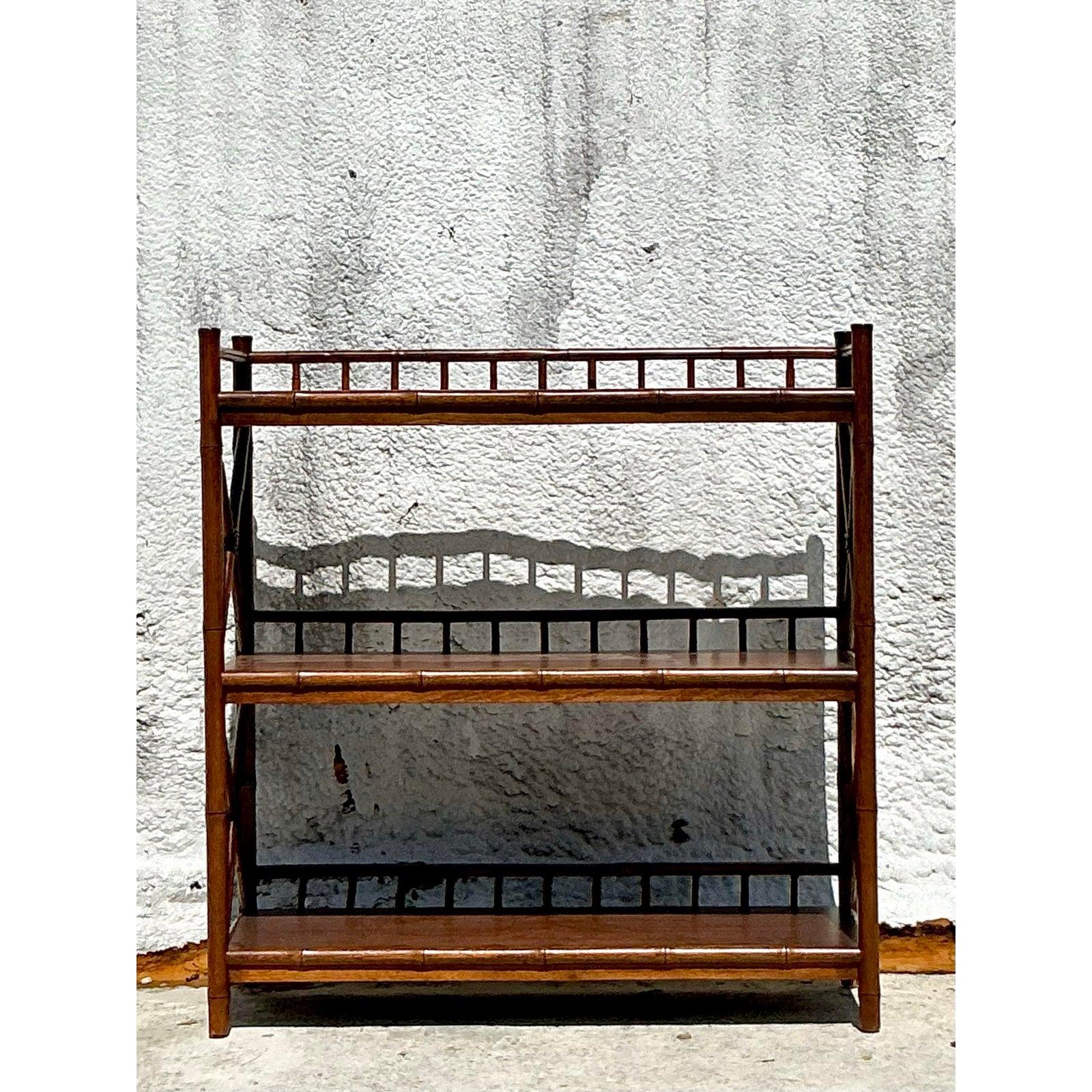Add a touch of laid-back bohemian charm and natural texture to your space with this delightful vintage low etagere crafted from bamboo. Featuring multiple shelves set within a warm bamboo frame, this piece exudes a relaxed yet stylish vibe. The