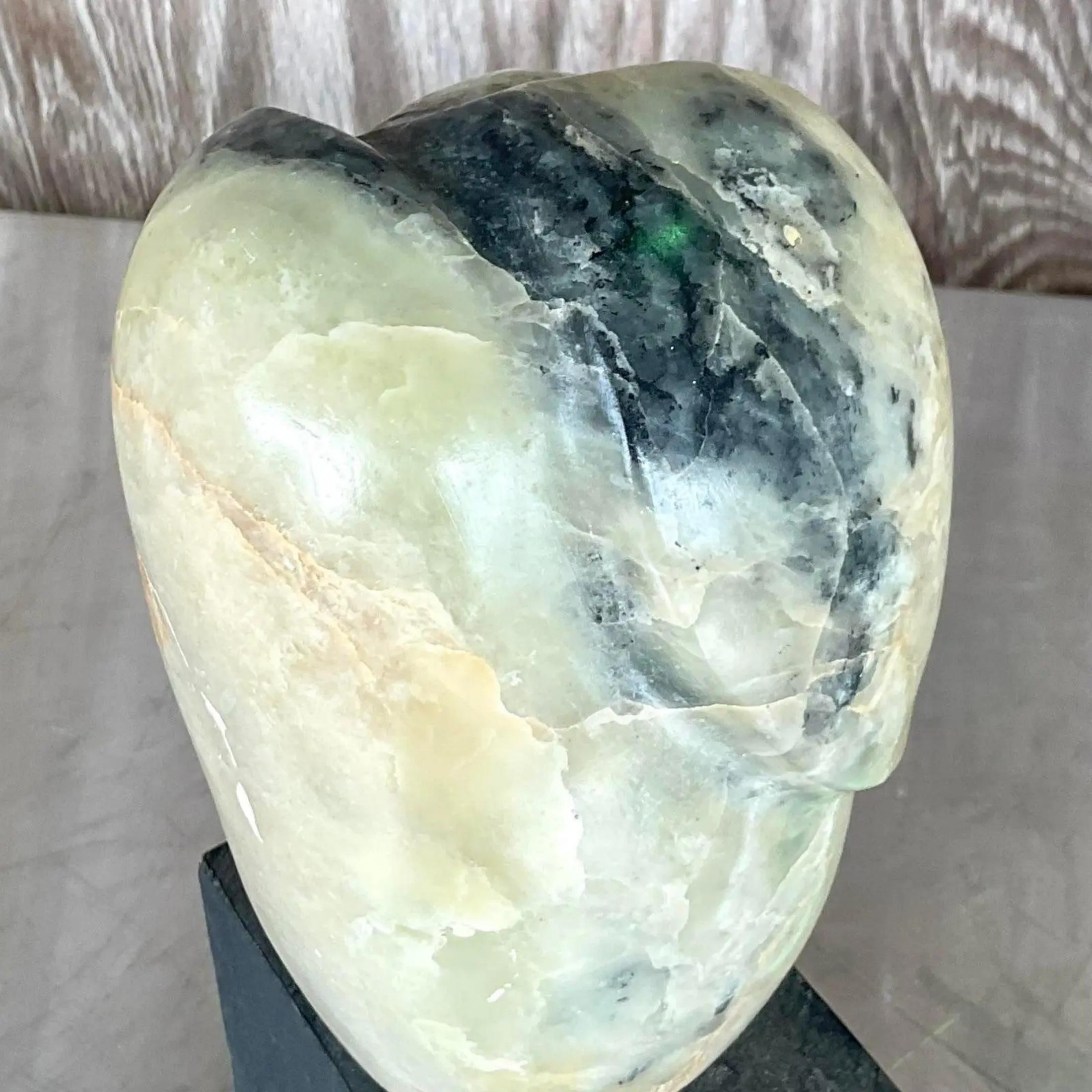 Fantastic vintage Boho Sculpture. Beautiful hand carved stone in striking pale greens and black. Rests on a black painted wood block. Acquired from a Palm Beach estate
