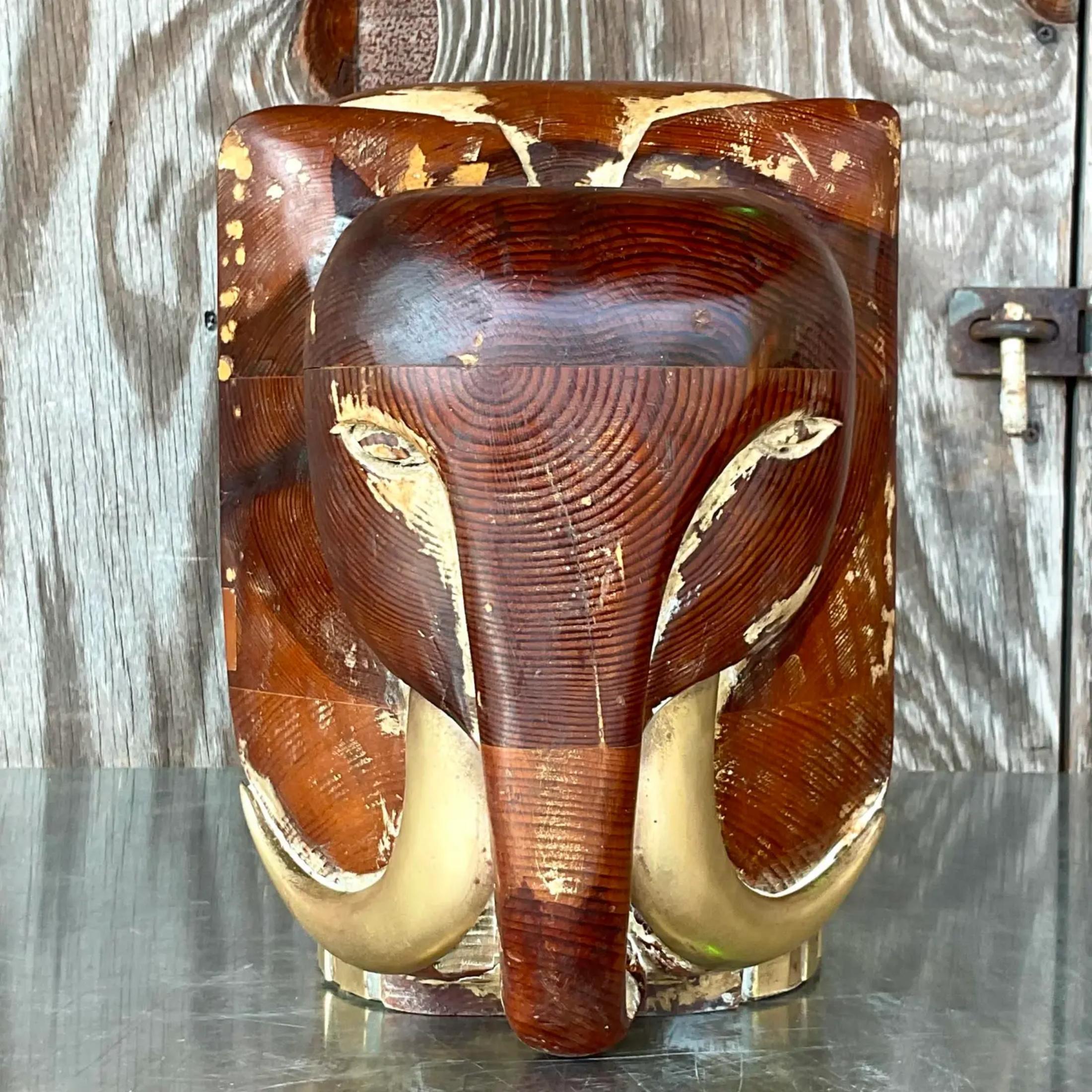 A stunning vintage 90s carved wooden elephant. A chic little fella made from carved wood with brass hardware. Beautiful wood grain detail. Acquired from a Palm Beach estate