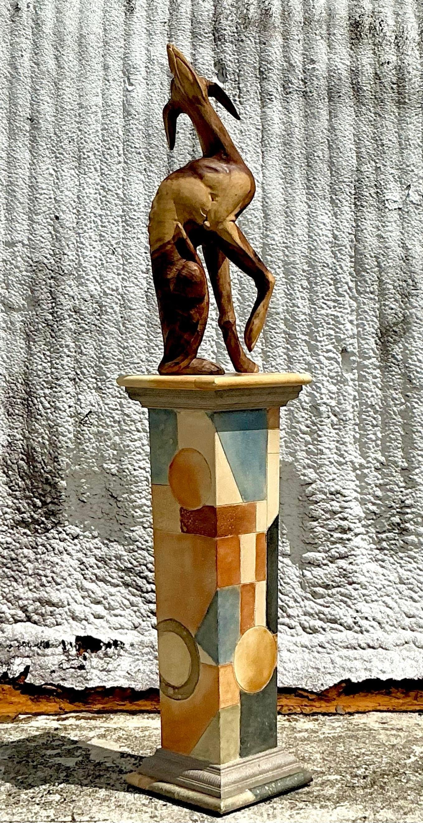 Bring a touch of natural artistry and elegance to your space with this stunning Vintage Boho Carved Wood Greyhound. Beautifully hand-carved from a single piece of rich, swirled wood, this sculpture captures the sleek and graceful form of a greyhound