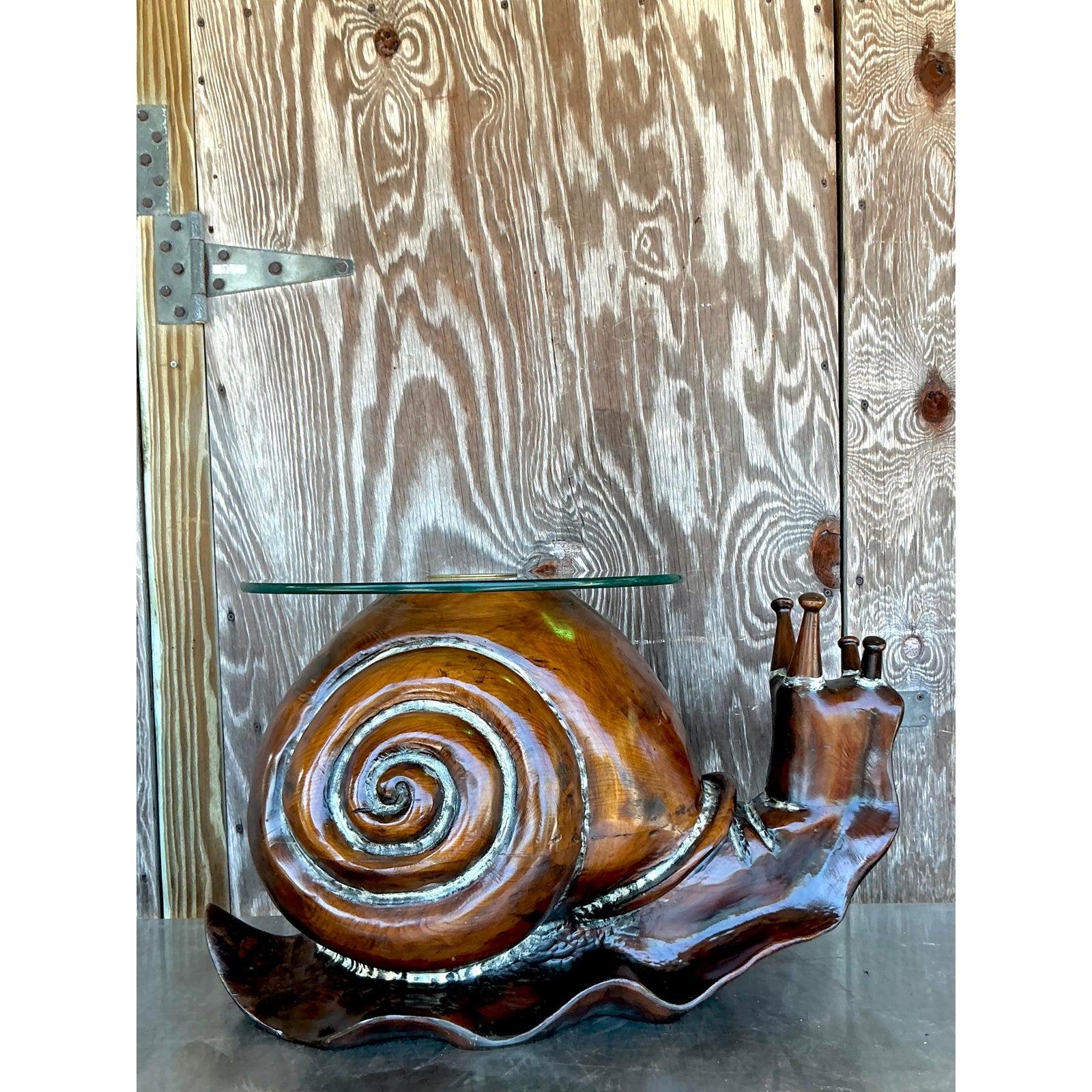 Infuse your living space with unparalleled artistic charm and organic appeal with this vintage coffee table in the style of artist Frederick Armijo. This truly unique piece features a substantial base masterfully carved from wood to depict a