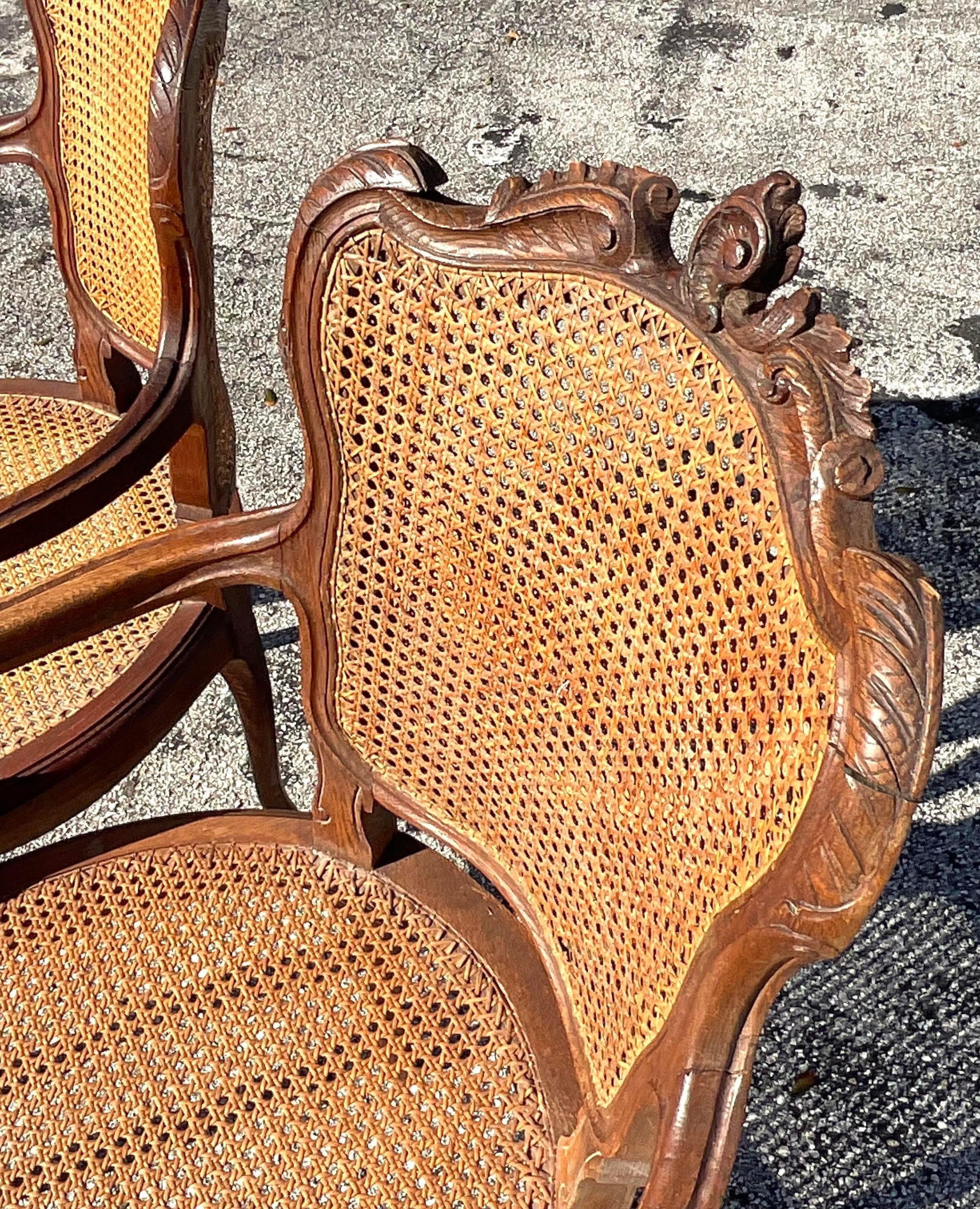 American Vintage Boho Carved Wooden Chairs With Inset Cane Panels - a Pair For Sale