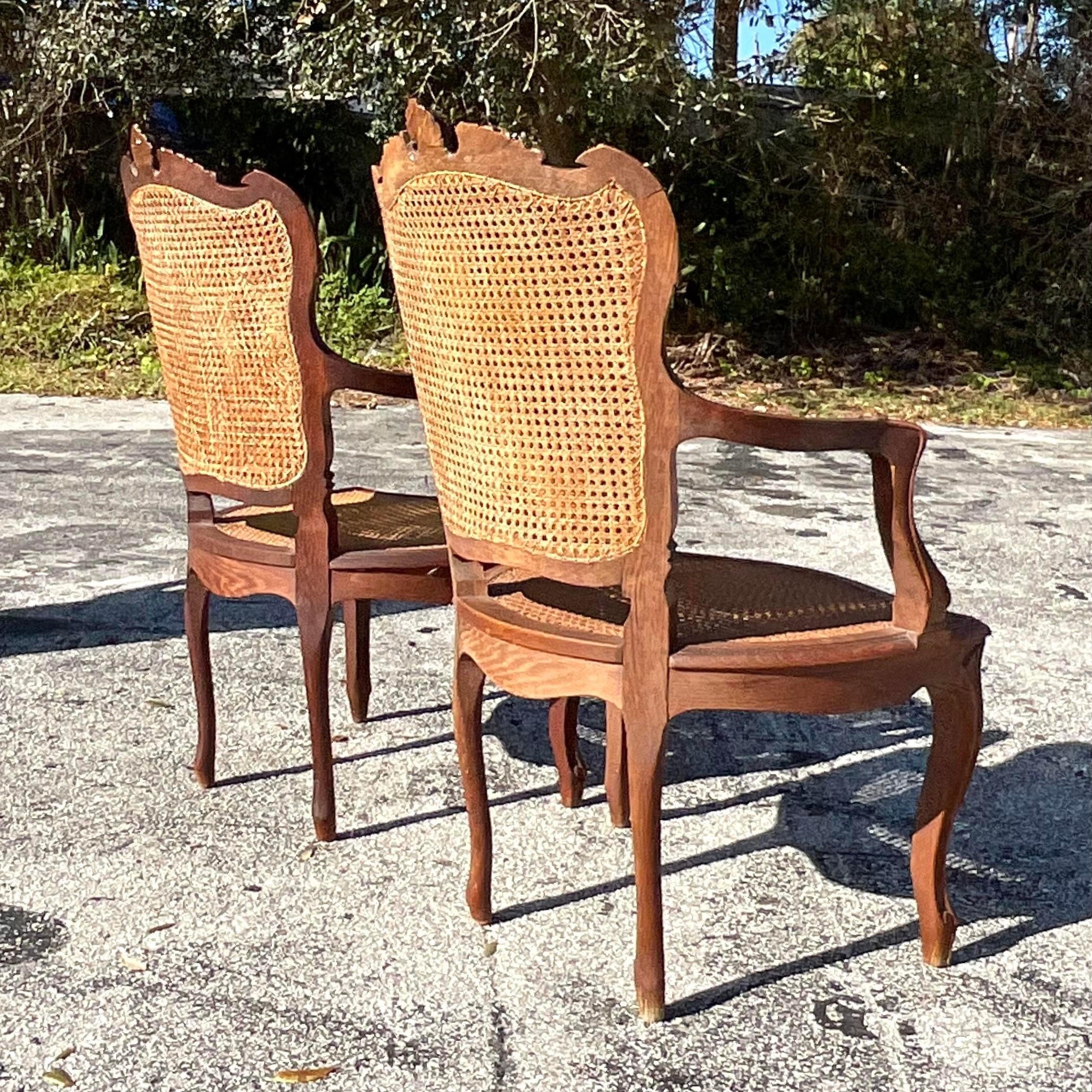 20th Century Vintage Boho Carved Wooden Chairs With Inset Cane Panels - a Pair For Sale